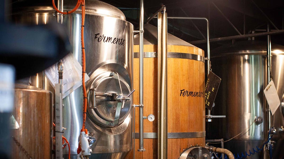 Stainless steel and wooden beer tanks