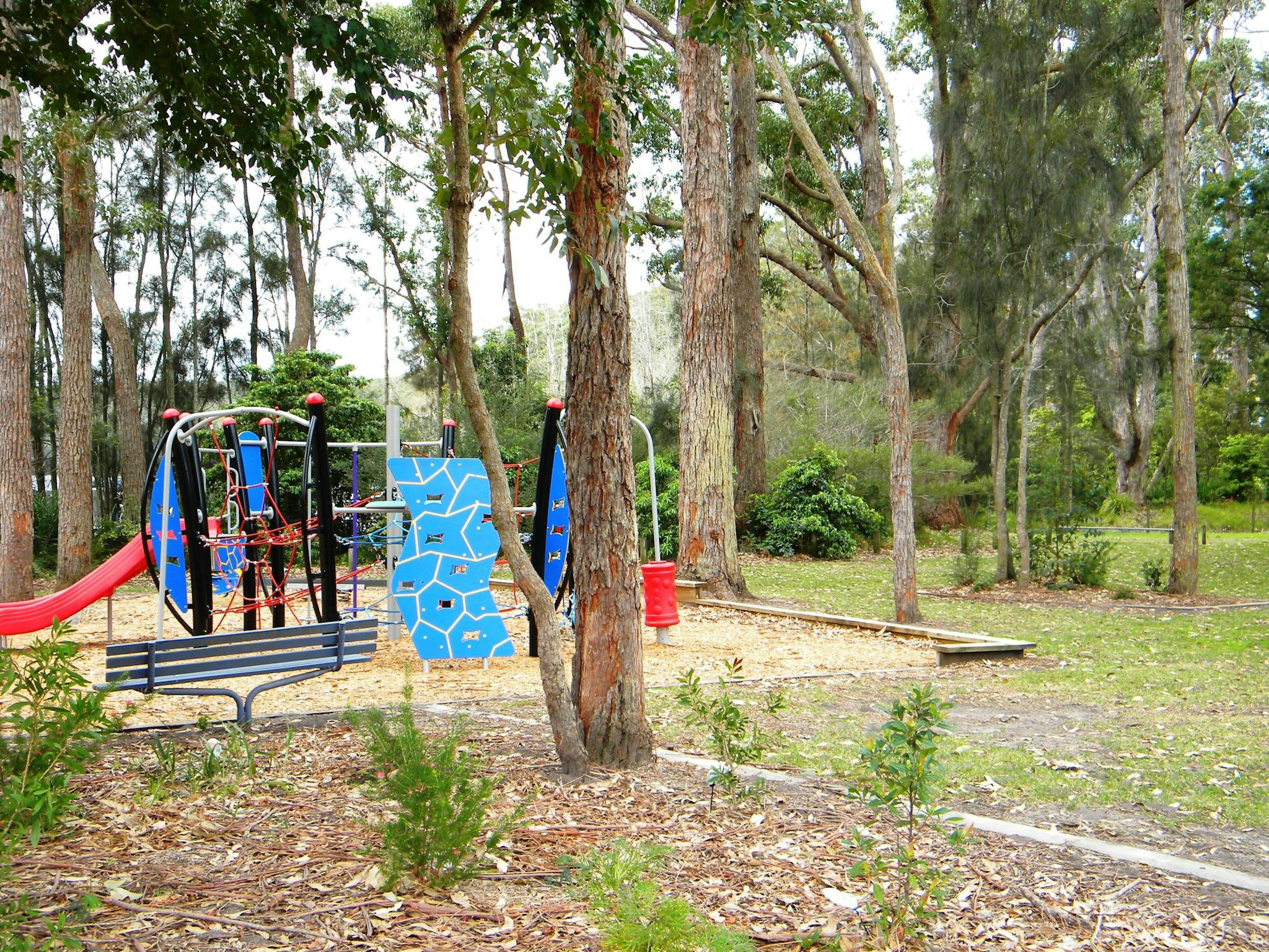A children's playground and garden beside the water at King's Point.