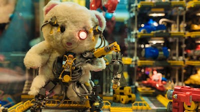 Closeup image of RELICS exhibition with vintage teddy bear and LEGO® elements