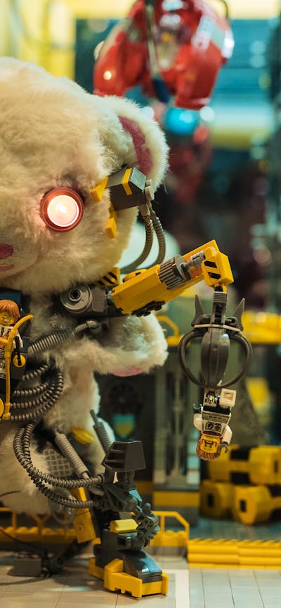 Closeup image of RELICS exhibition with vintage teddy bear and LEGO® elements