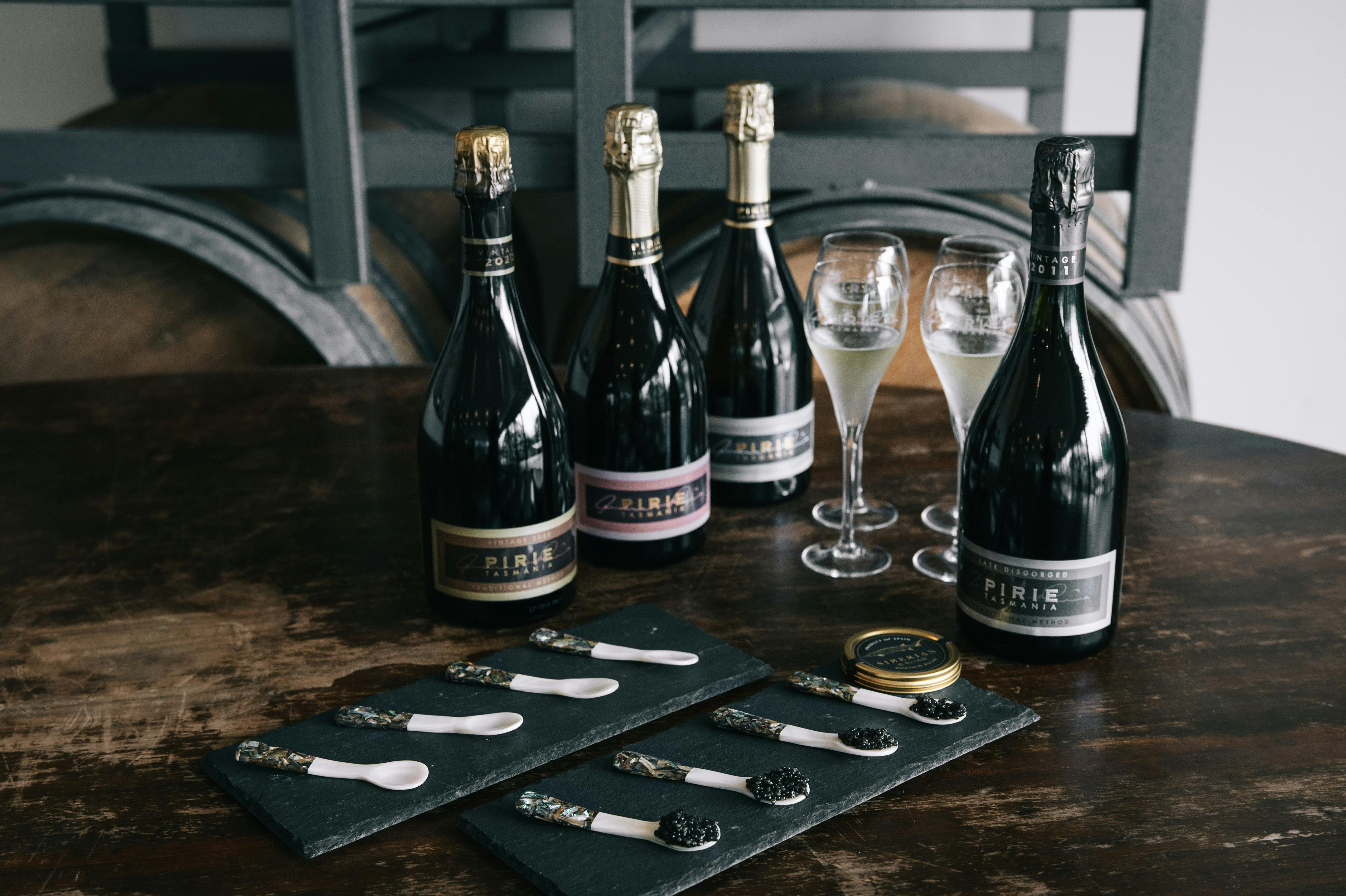 Pirie wine bottles with glasses and caviar spoons