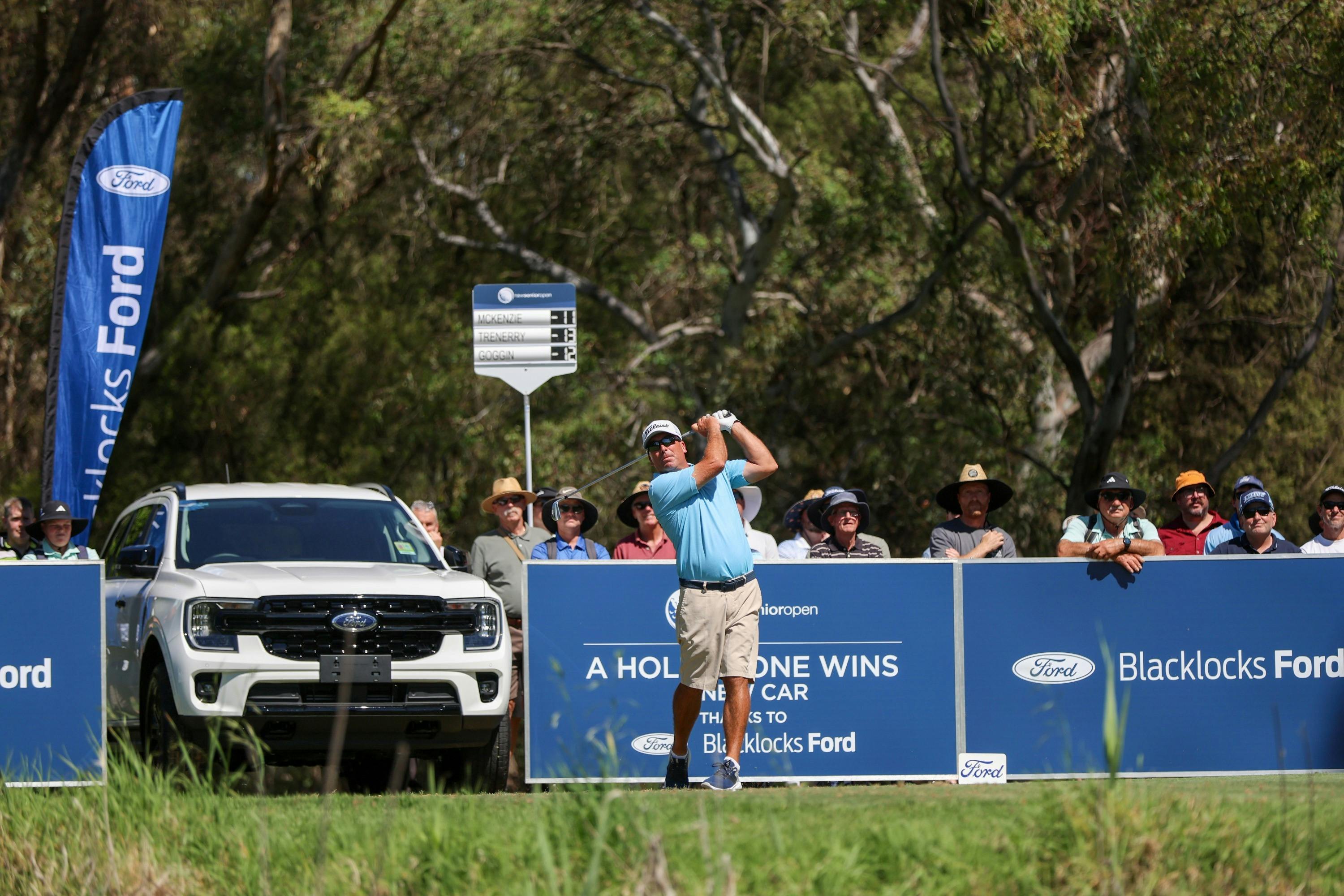 Golfer teeing off on the Hole in One Hole