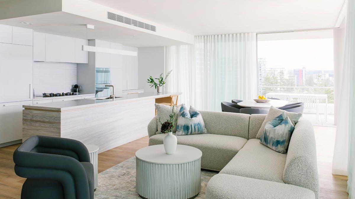 Spacious Kirra Point apartment with gourmet kitchen, coastal lounge, and balcony park views.