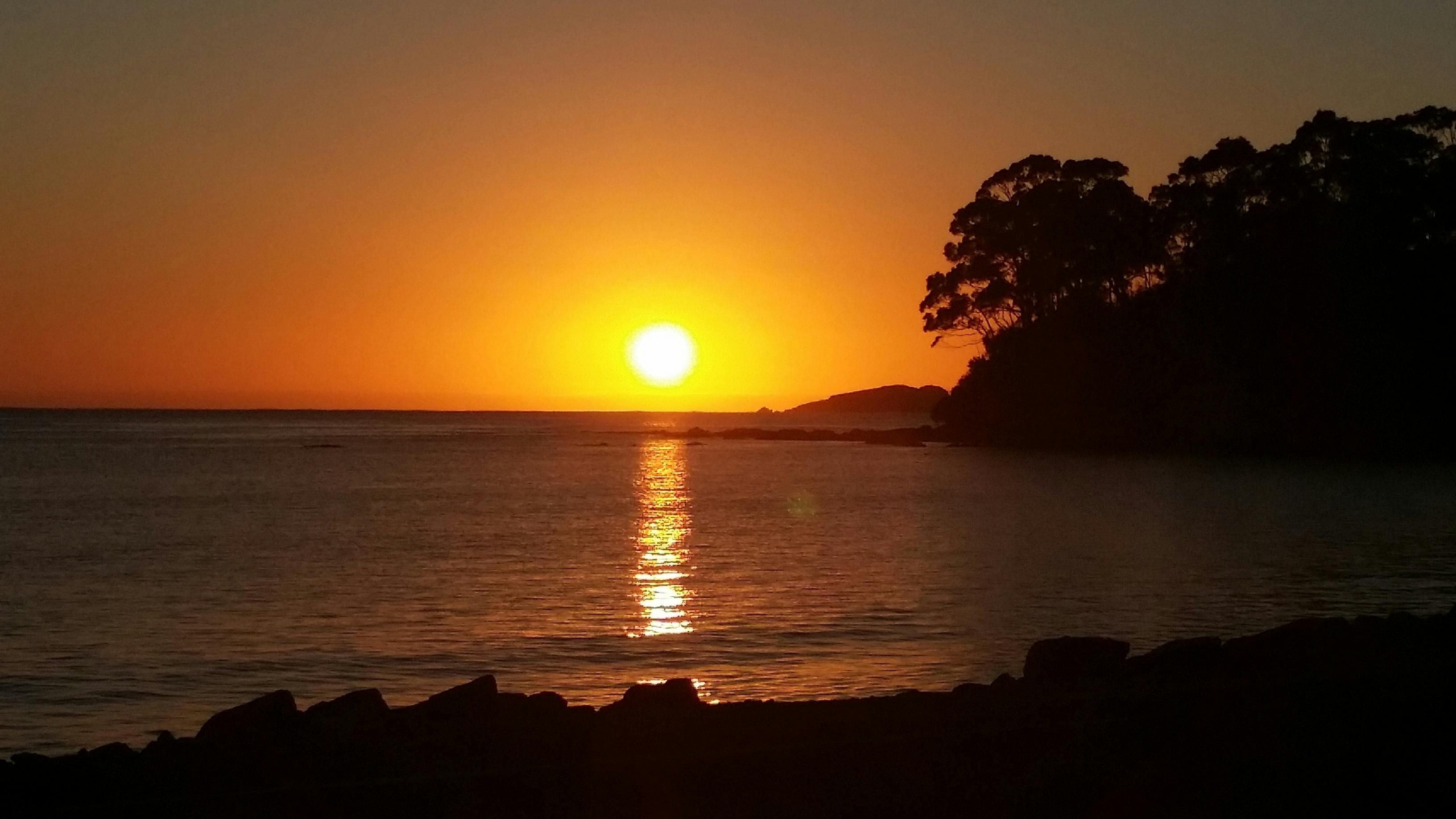sun rising over the ocean south east australia