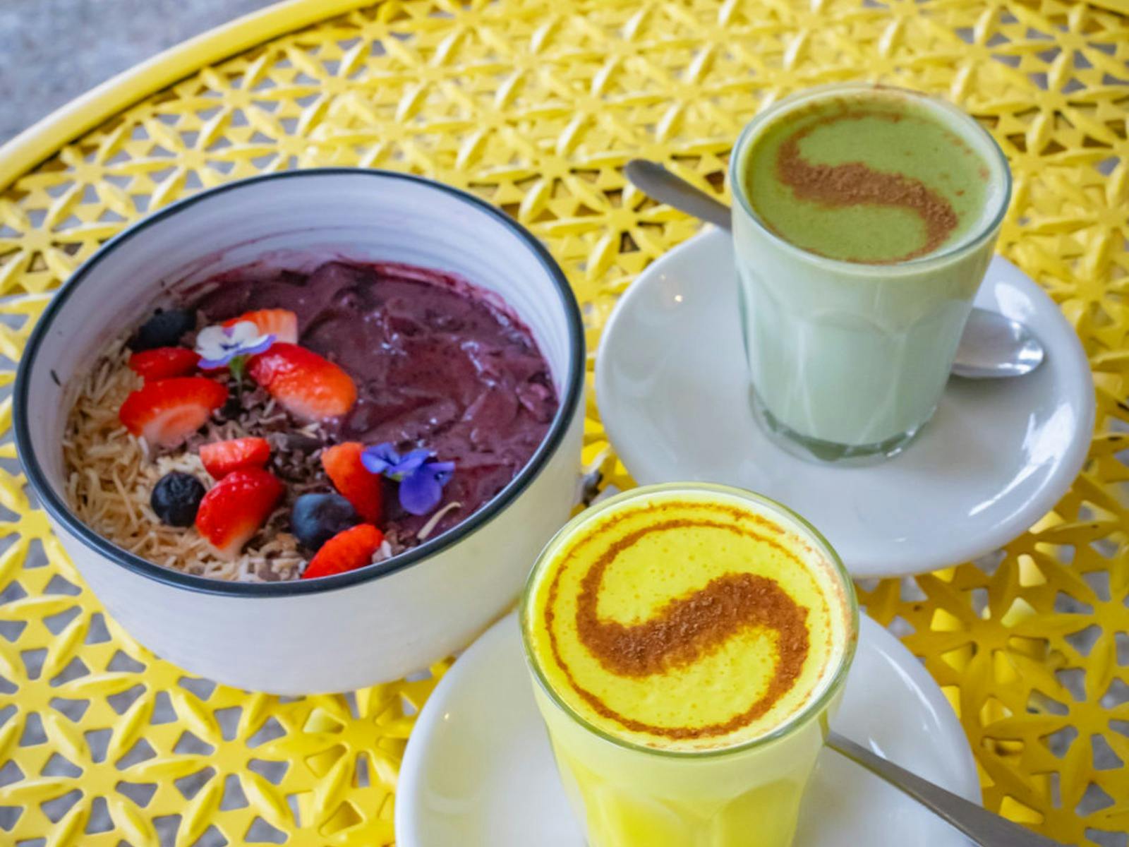 Matcha and Tumeric Latte and Acai Bowl at Toast Eden
