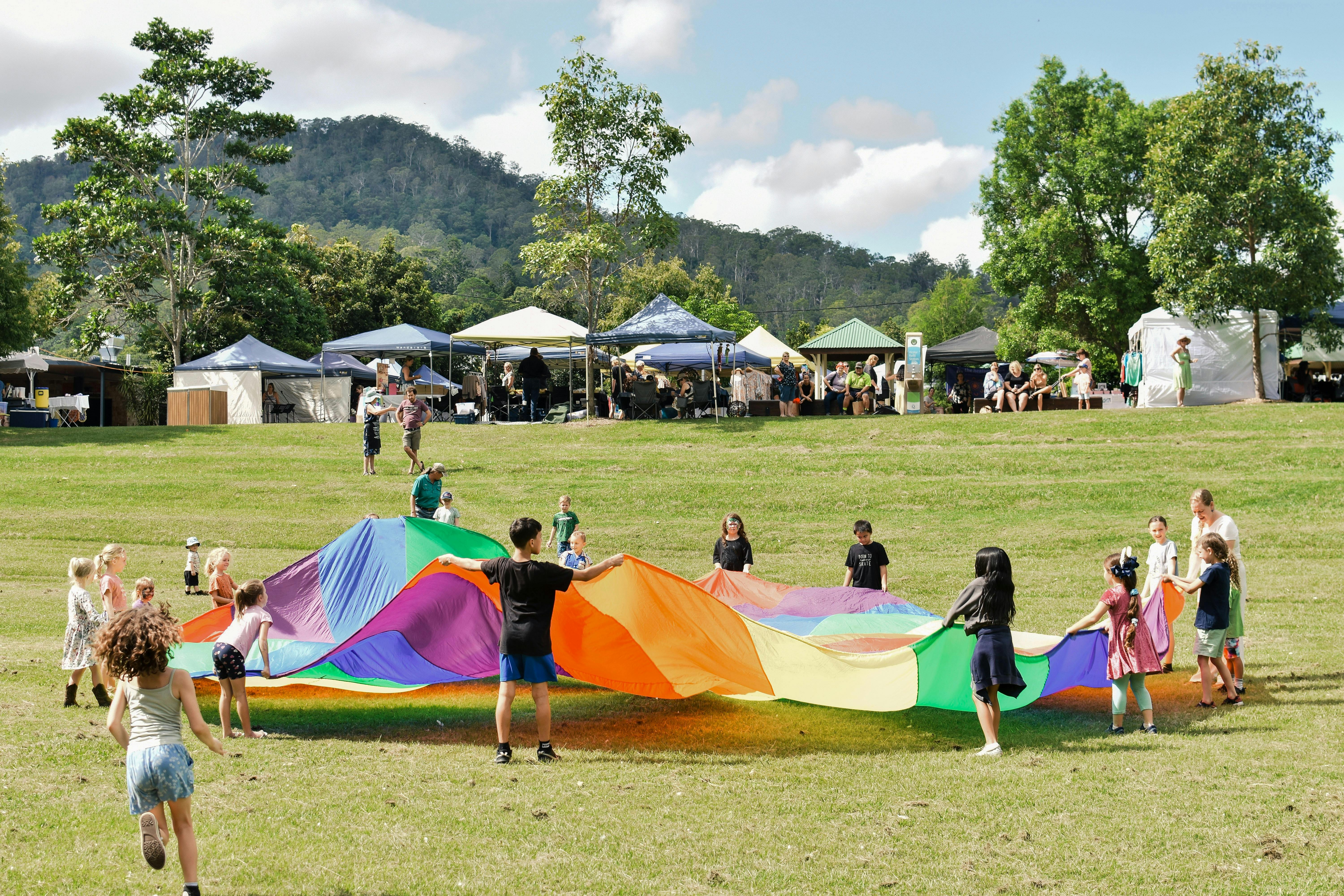 Rainbow parachute with children. Fairymount backdrop