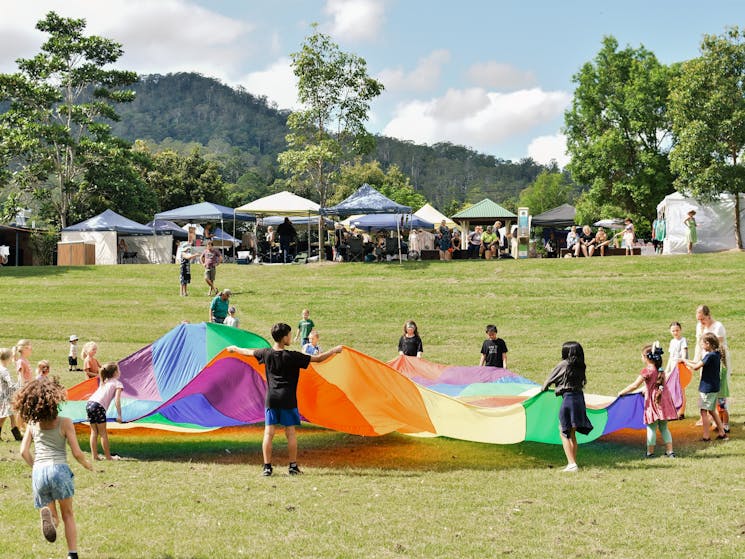 Rainbow parachute with children. Fairymount backdrop