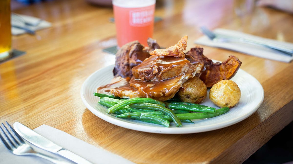 Plate of roast pot with green beans and potatoes