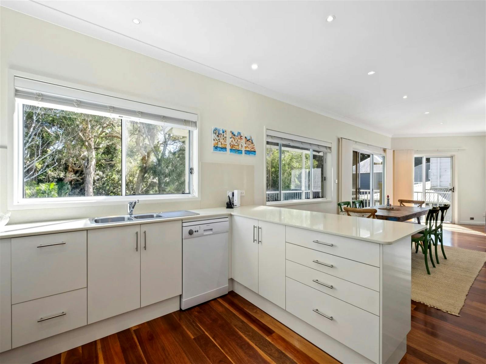 Spacious open-plan kitchen featuring modern appliances and ample room for cooking and entertaining