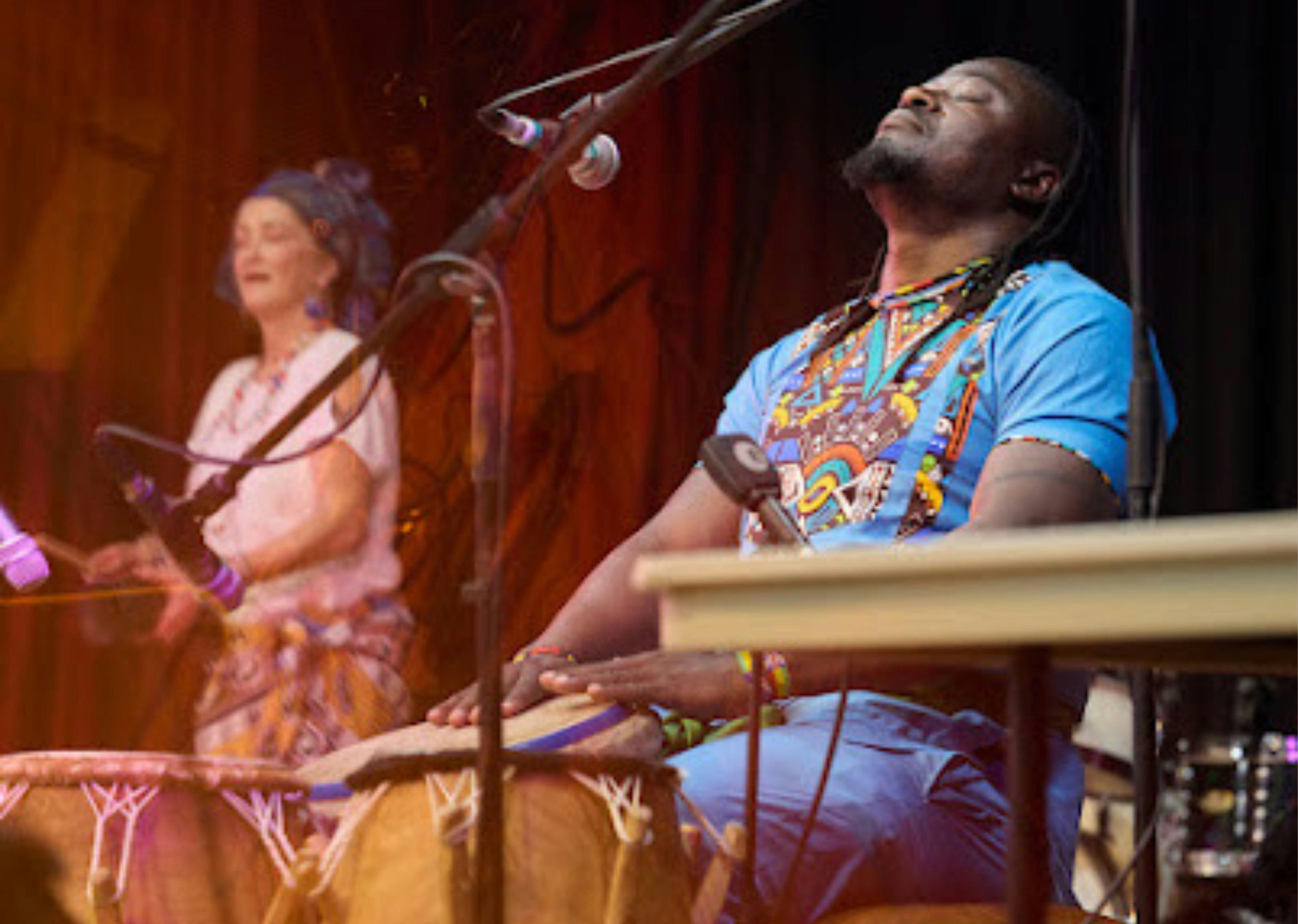 Two musicians on stage performing