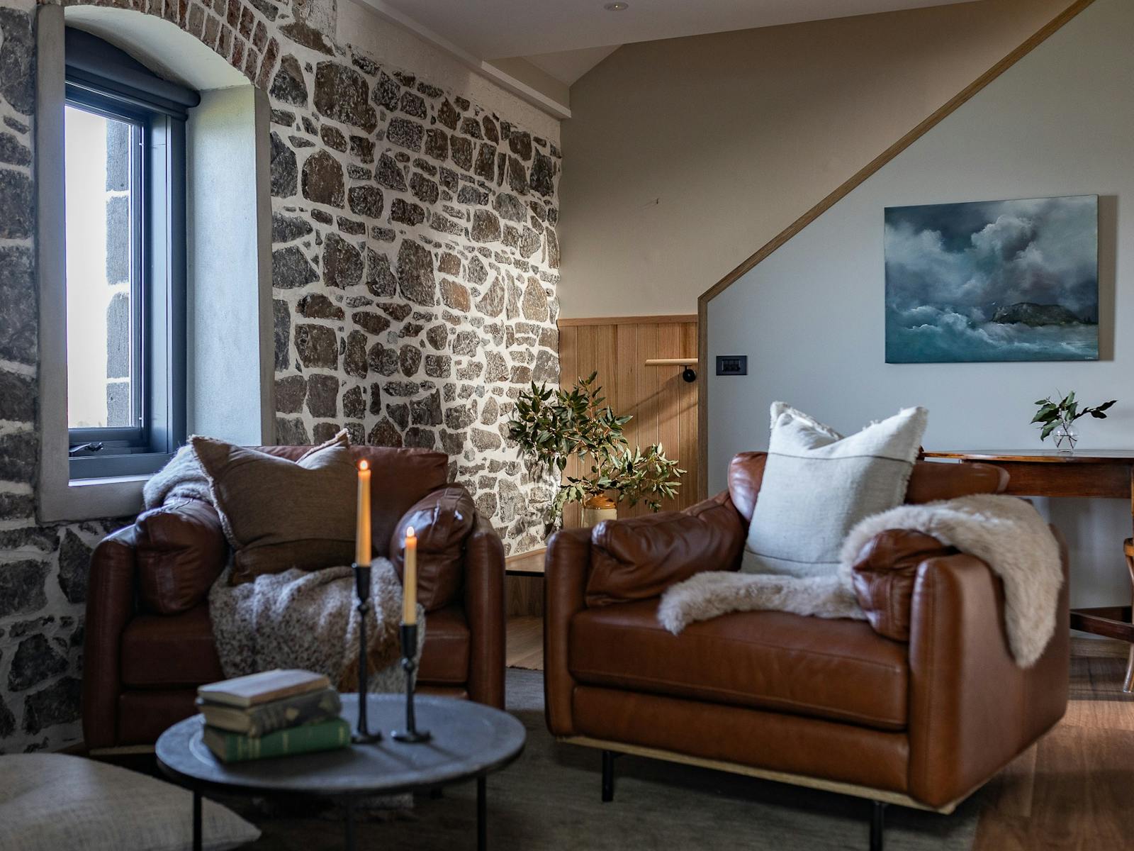 Bond Store one bedroom lounge area with wood fire, dining, kitchen and sunroom attached