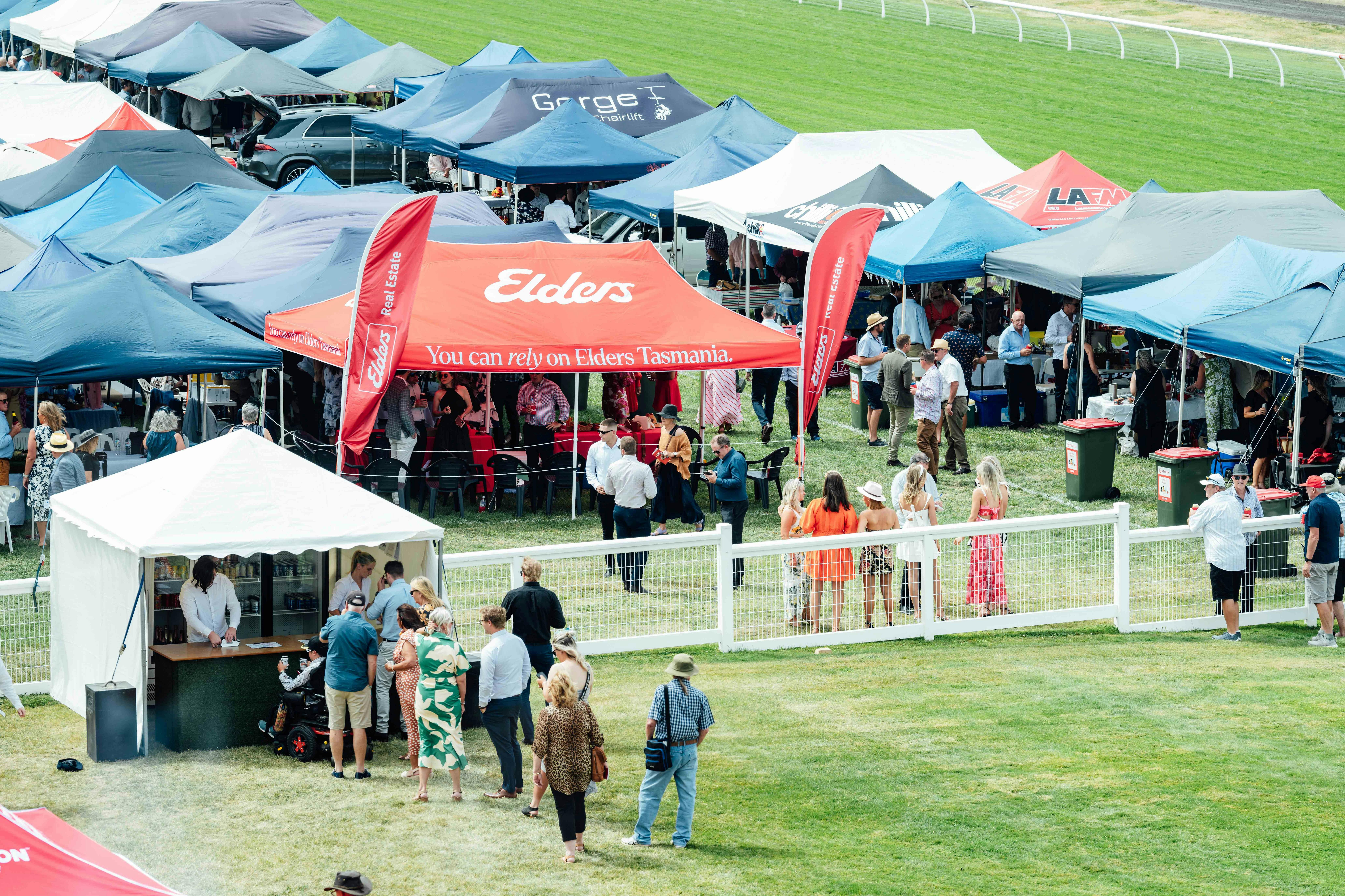 Line of marquees set up trackside