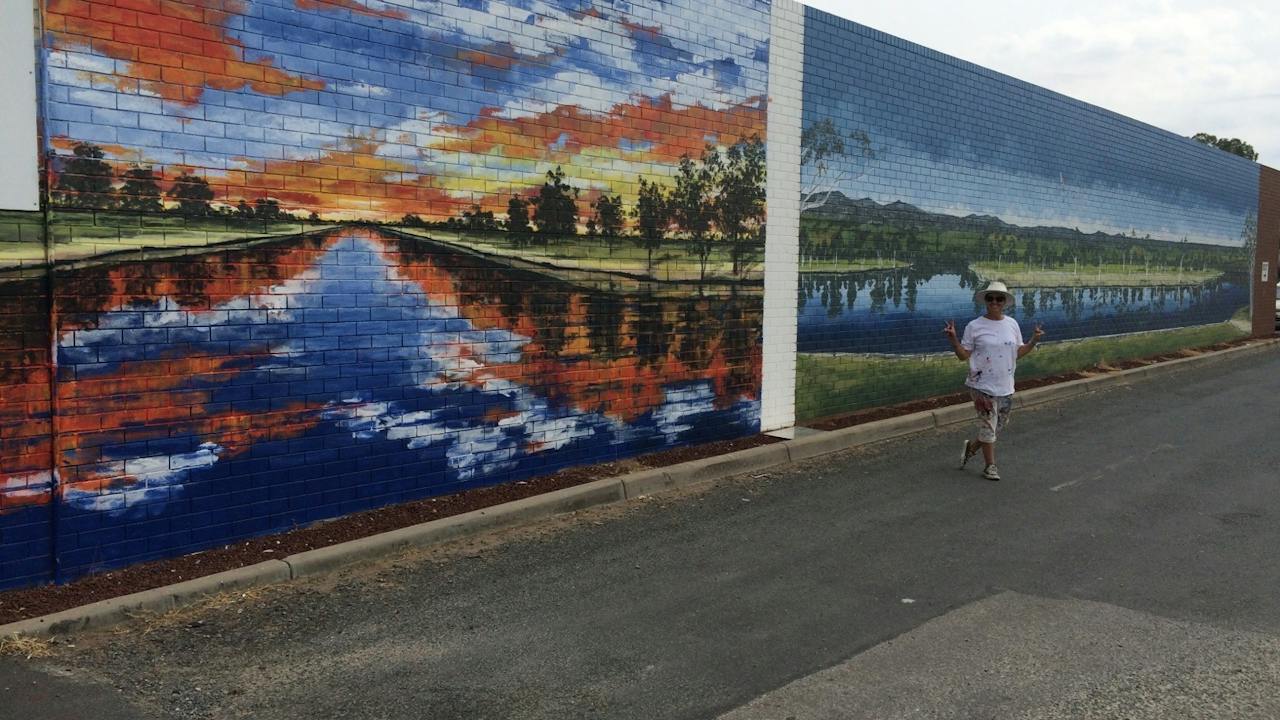 God's Country 1 and God's Country 2 murals, side by side.