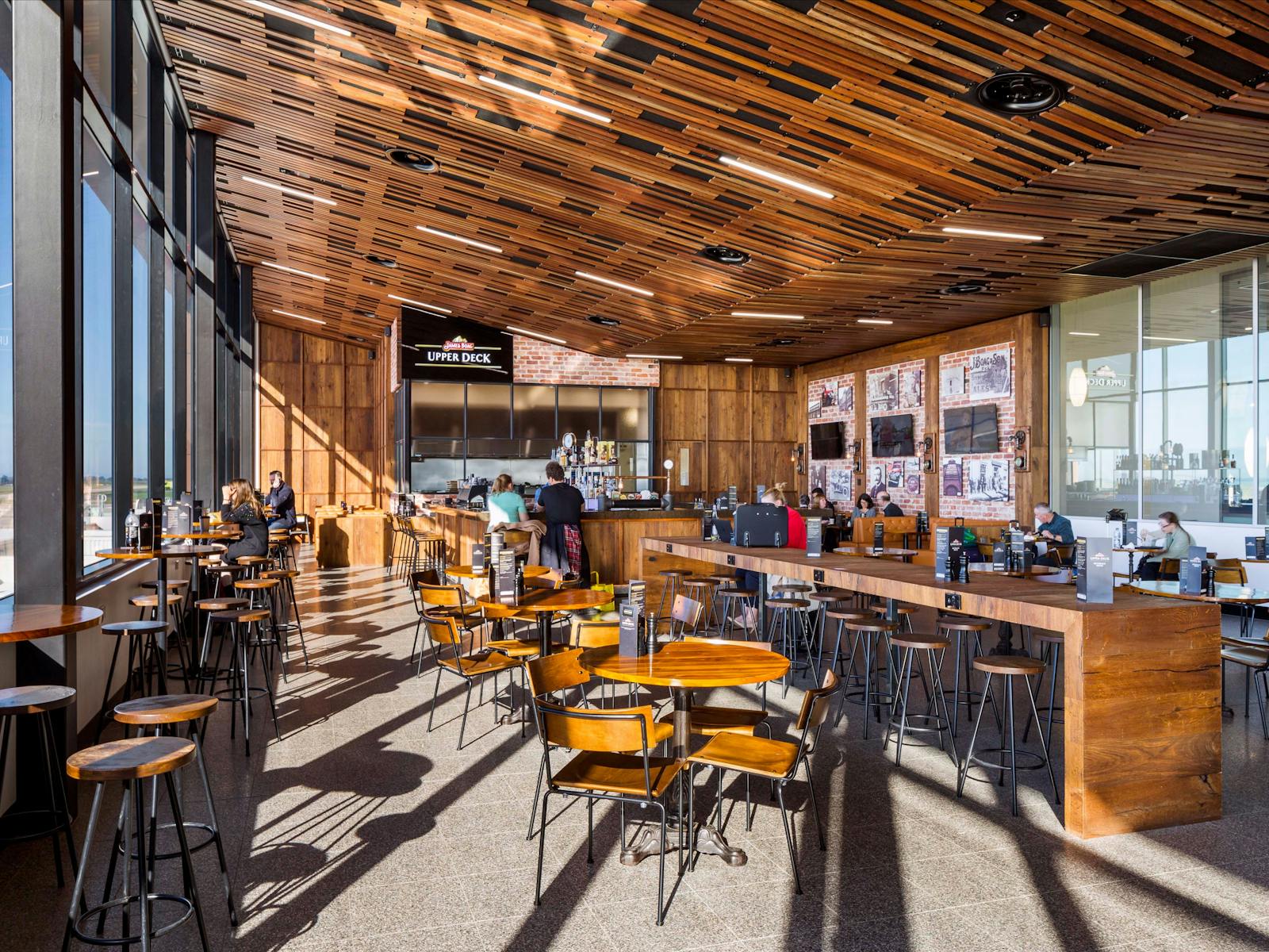 An extensive glass facade and raked timber ceiling adorns the award-winning Boags Bar & Restaurant