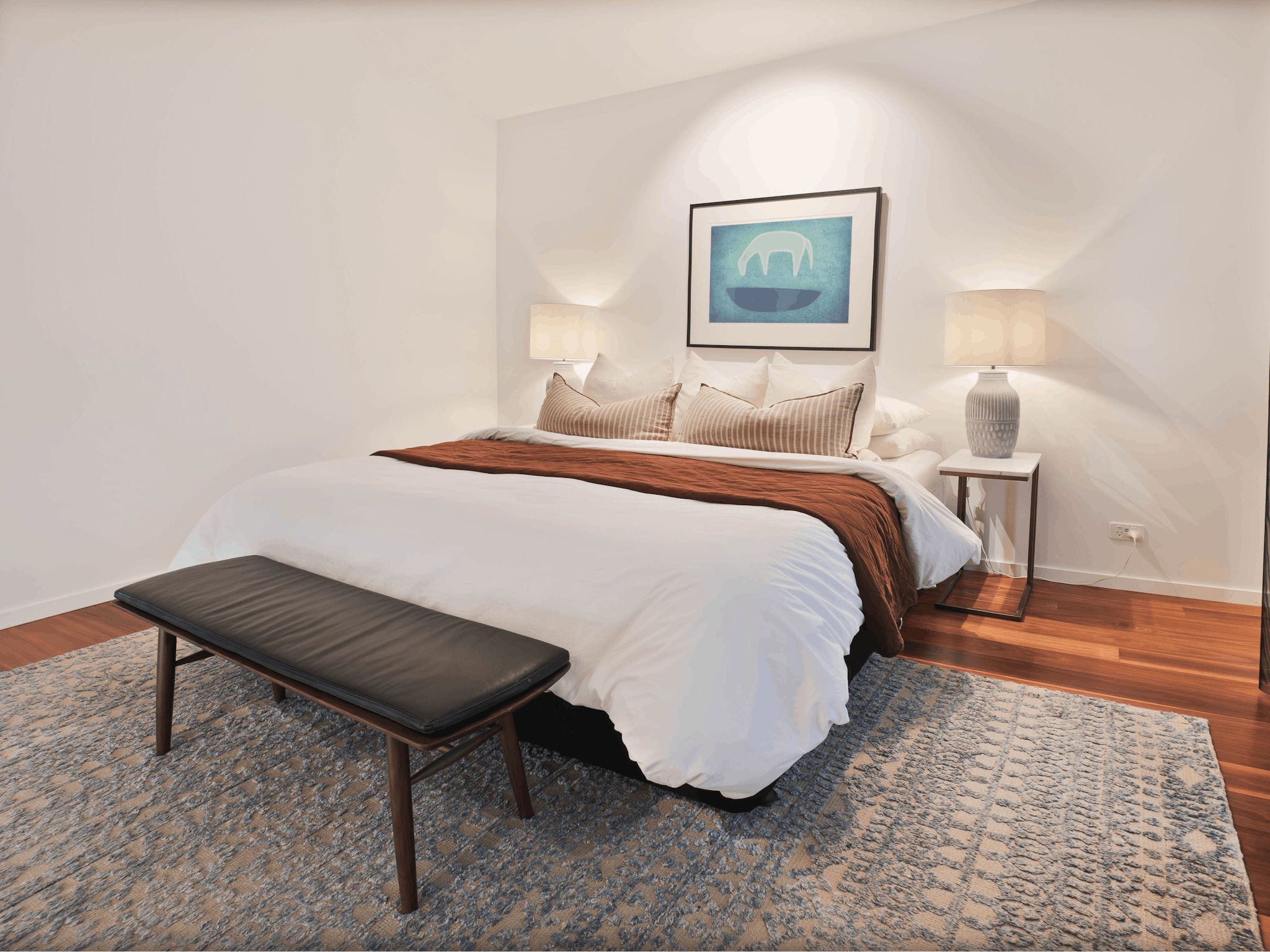 Olsen Penthouse bedroom with bed, bedside lamps