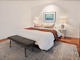 Olsen Penthouse bedroom with bed, bedside lamps