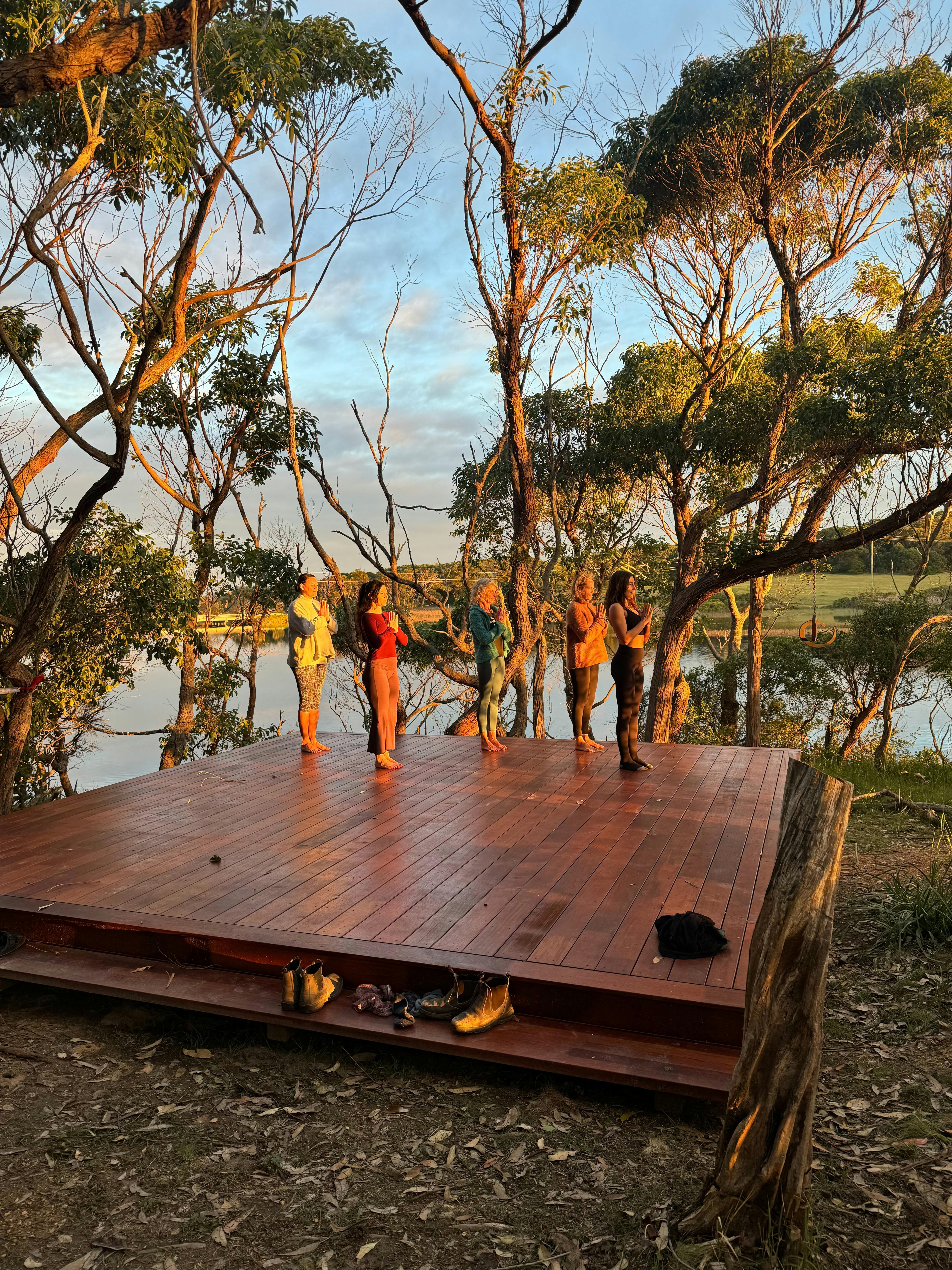 Prayer hands at sunset