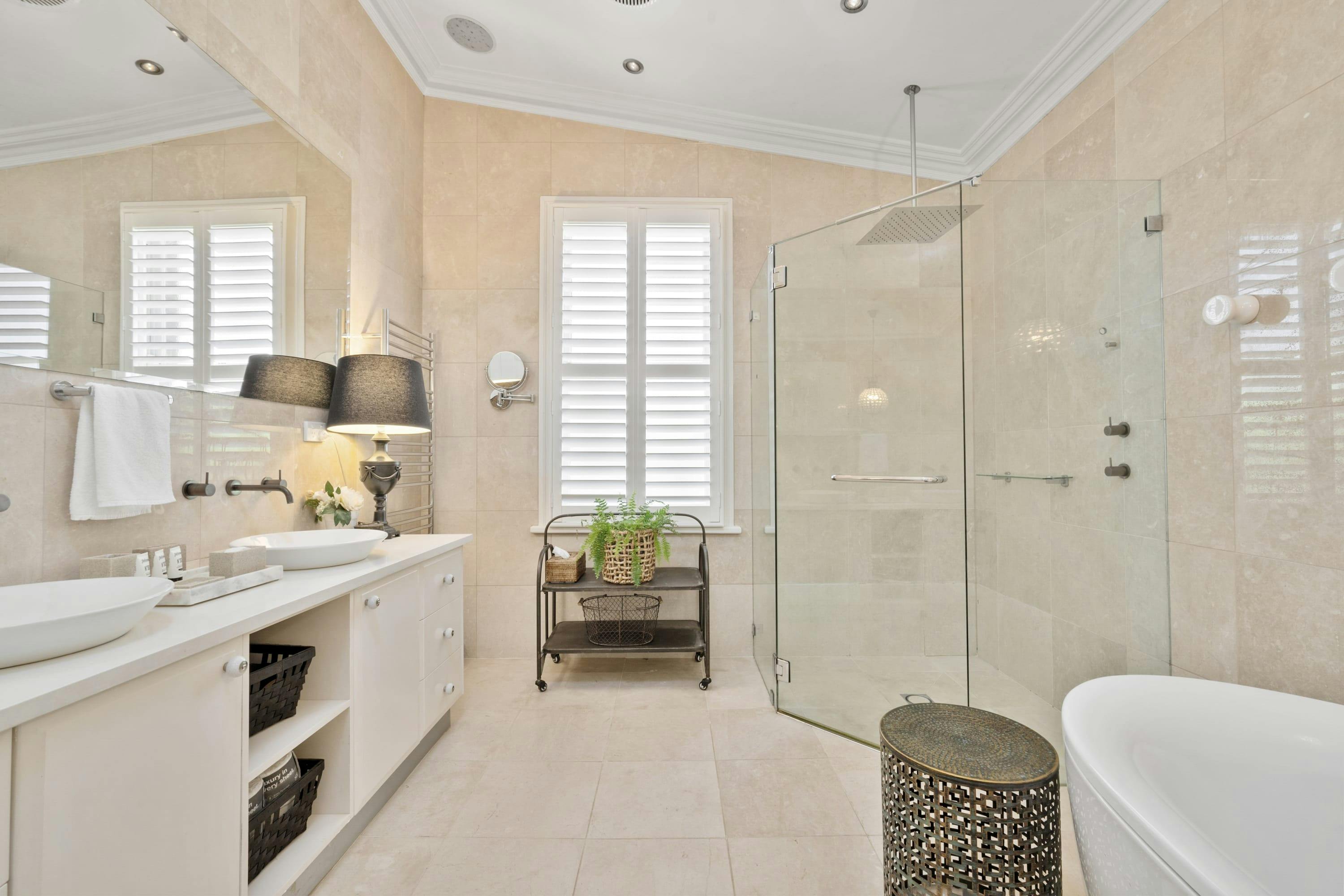 Bathroom with double vanity, shower and toilet