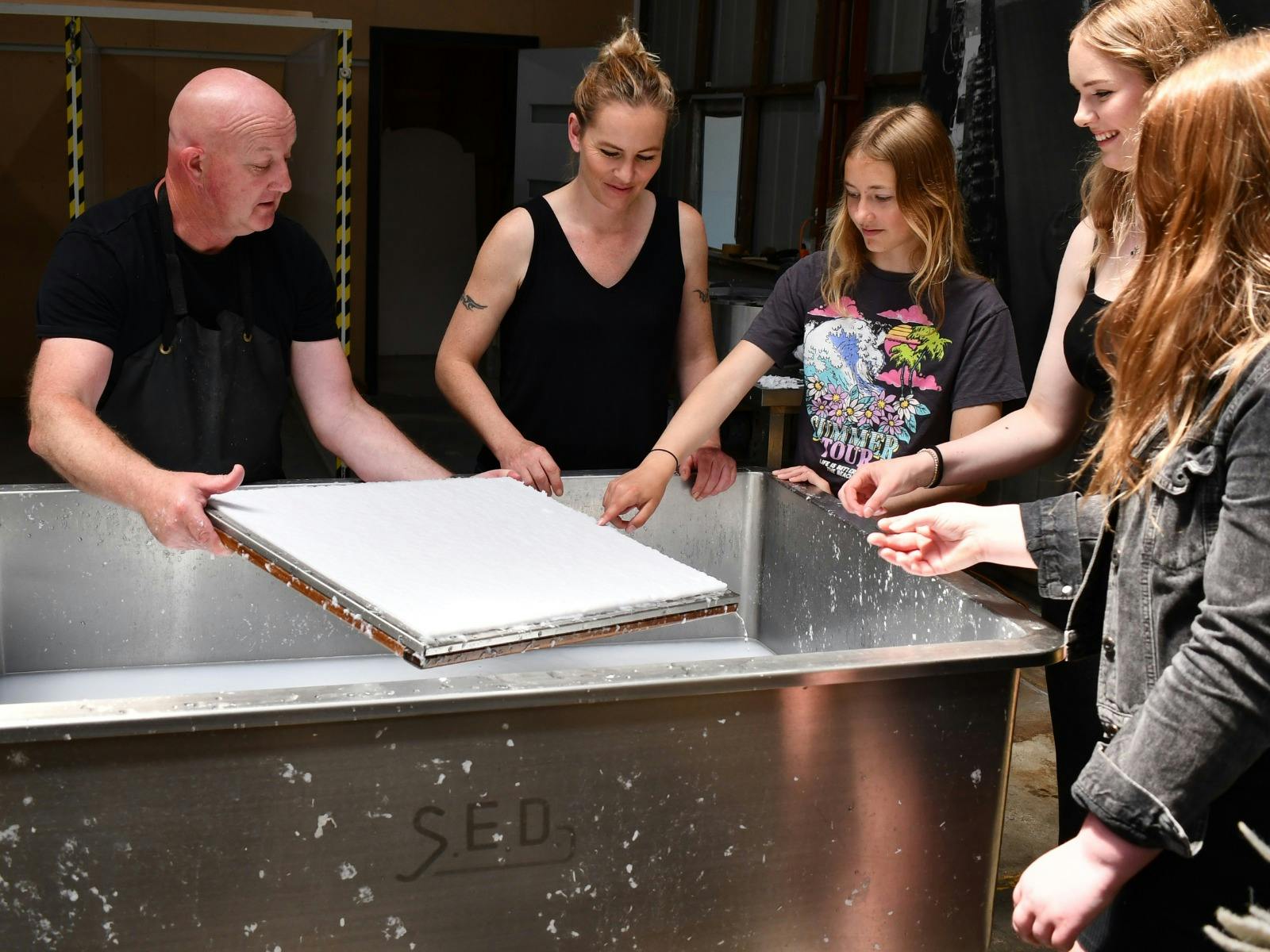Papermaker Darren Simpson explaining  how paper is made.