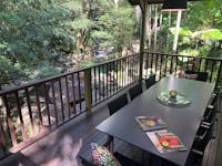 Outdoor dining with waterfall view at Daintree Secrets