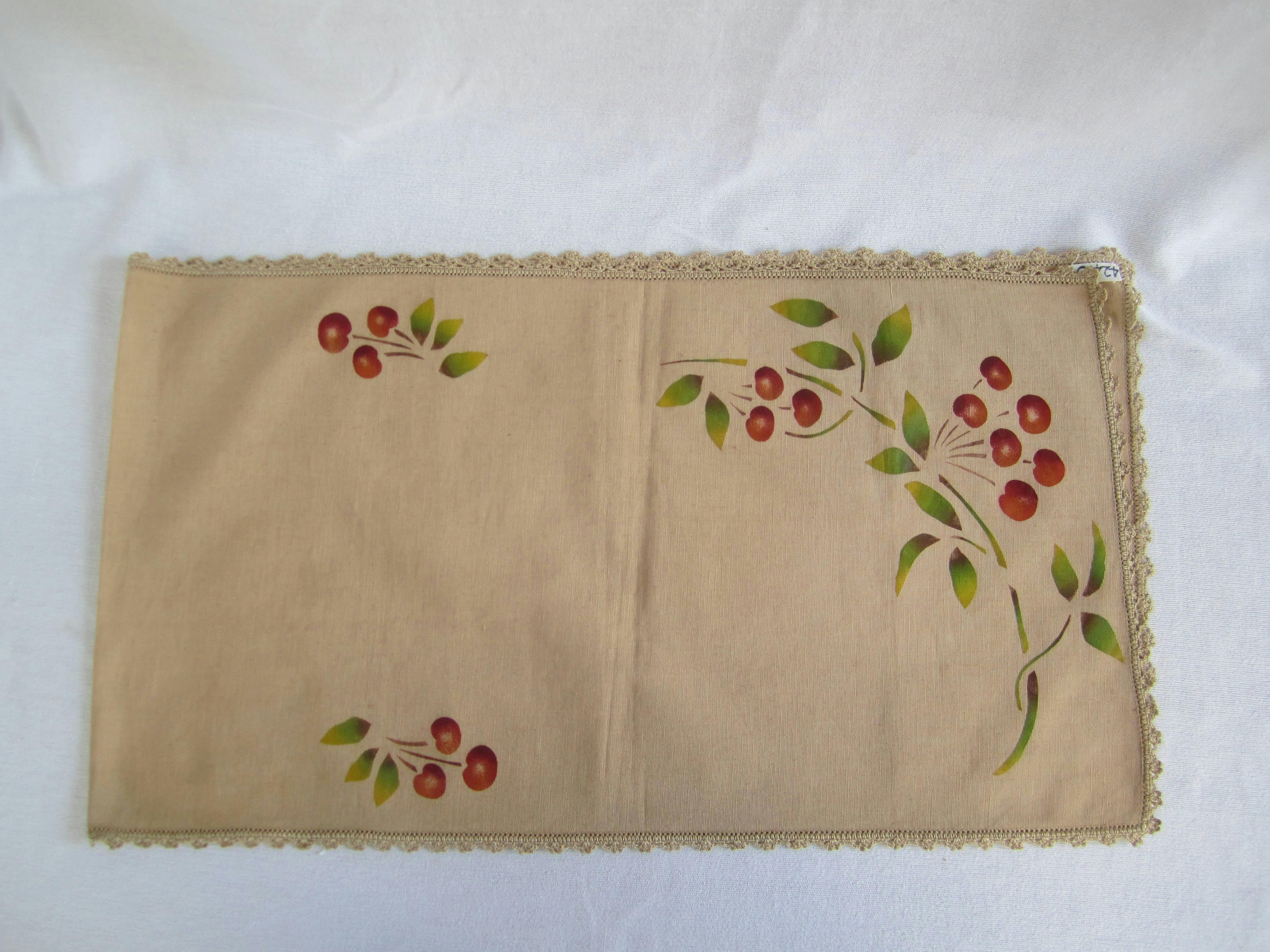 Tray cloth with stencilled work and crotched edging.