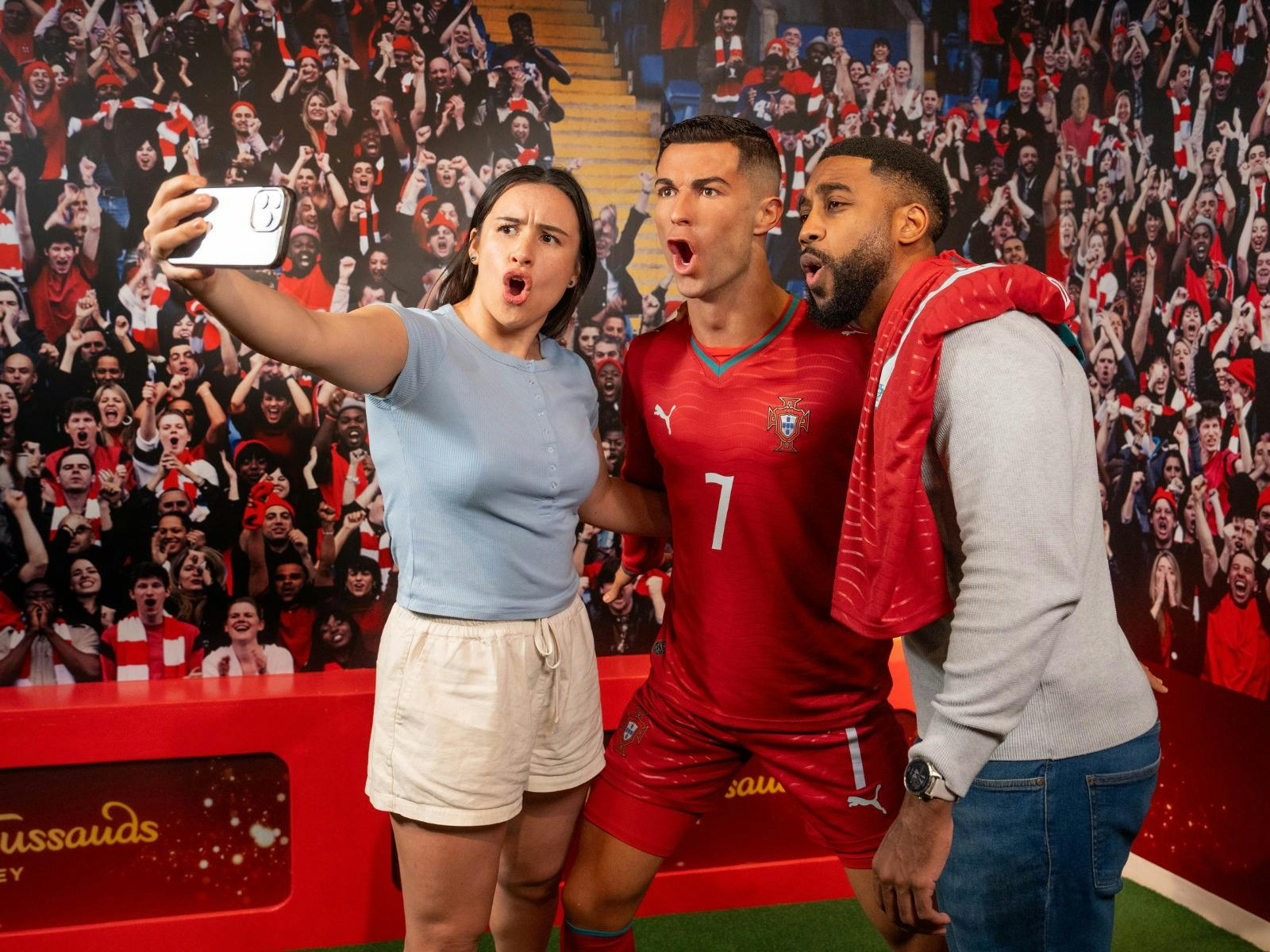 Fans posing with the iconic athlete, Christiano Ronaldo, at Madame Tussauds Sydney