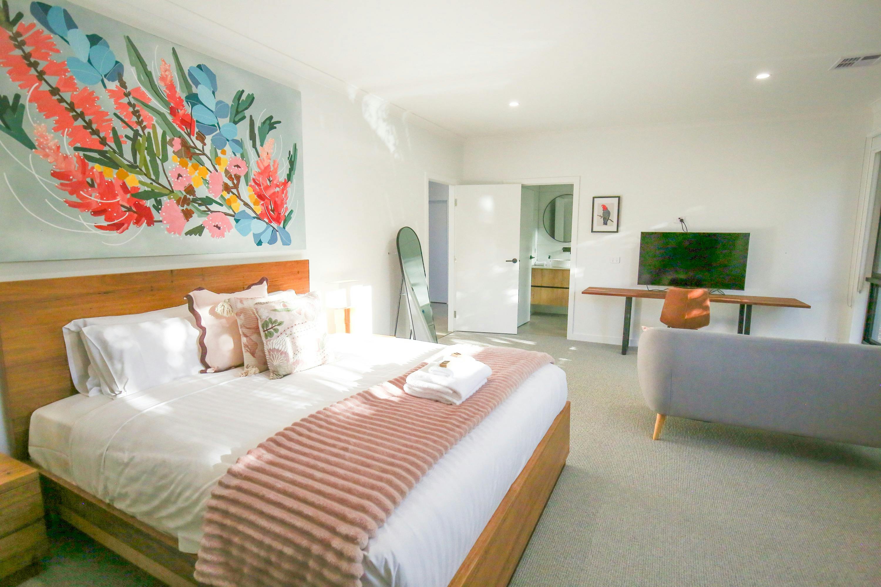 Master bedroom with sitting area and television Family Group accommodation Bright Victoria