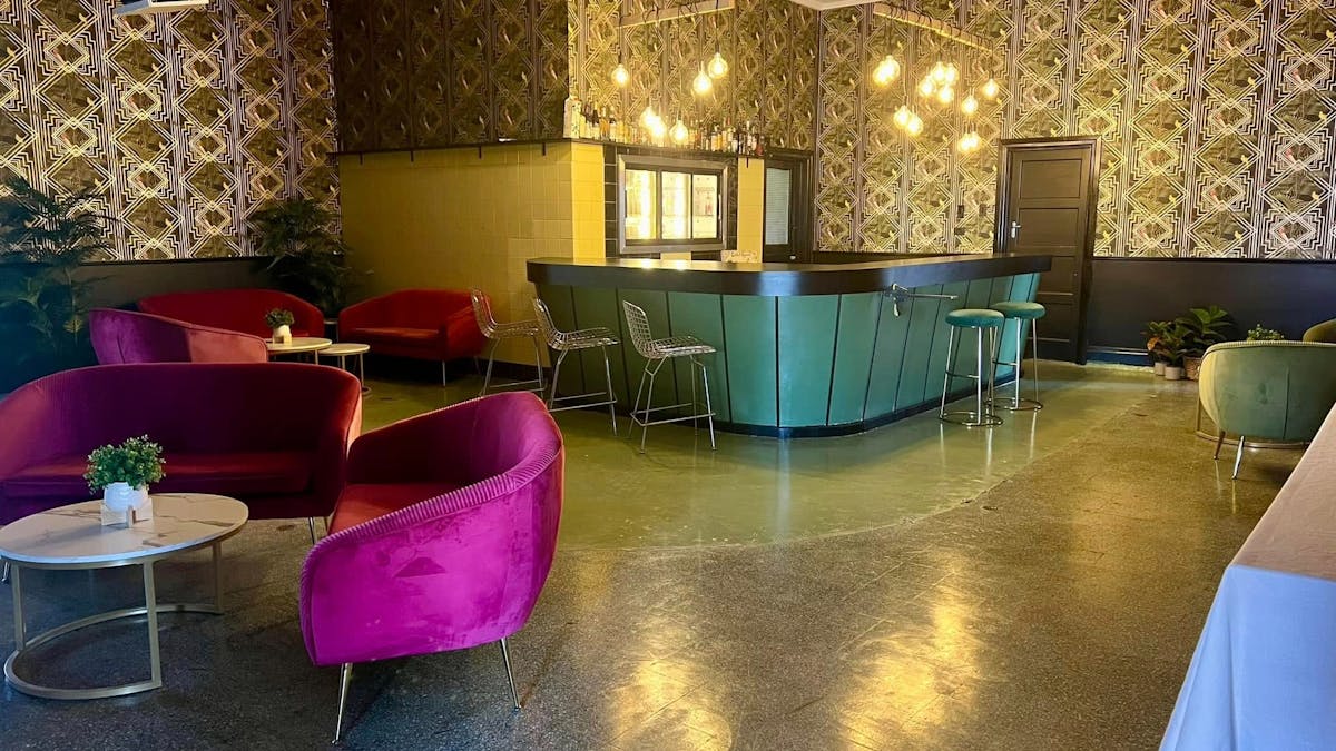 A beautifully restored Art Deco Bar with terrazo floors, red sofas patterned wallpaper @ the Old RSL A beautifully restored Art Deco Bar with terrazo floors, red sofas patterned wallpaper @ the Old RSL