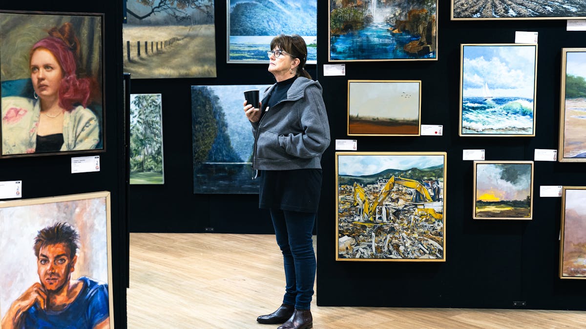 Person admires original artwork