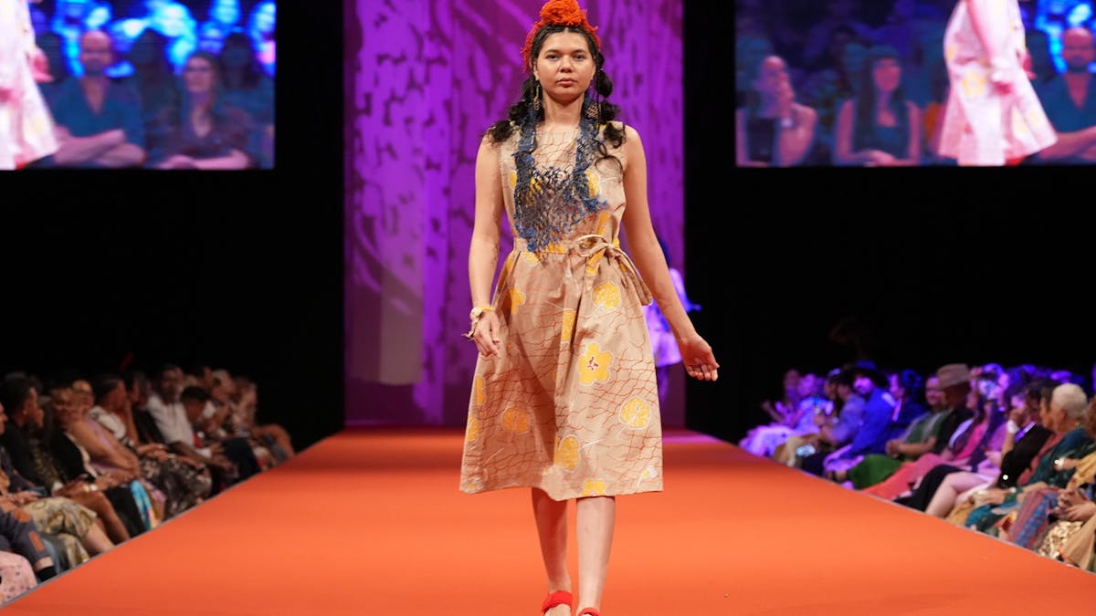 Model walking the runway wearing Magpie Goose brand