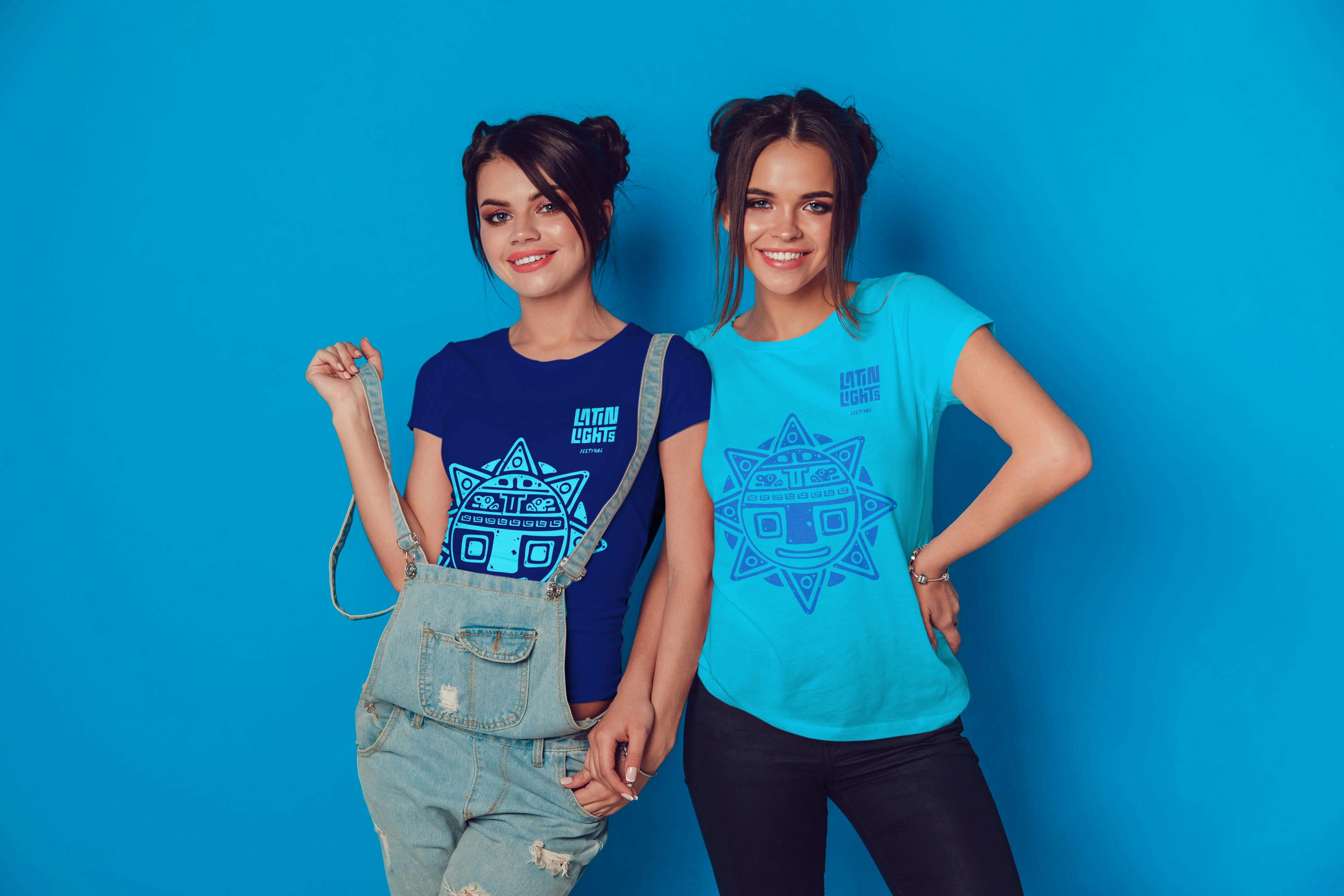 Two fans enjoying the merchandise of The Latin Lights Music Festival