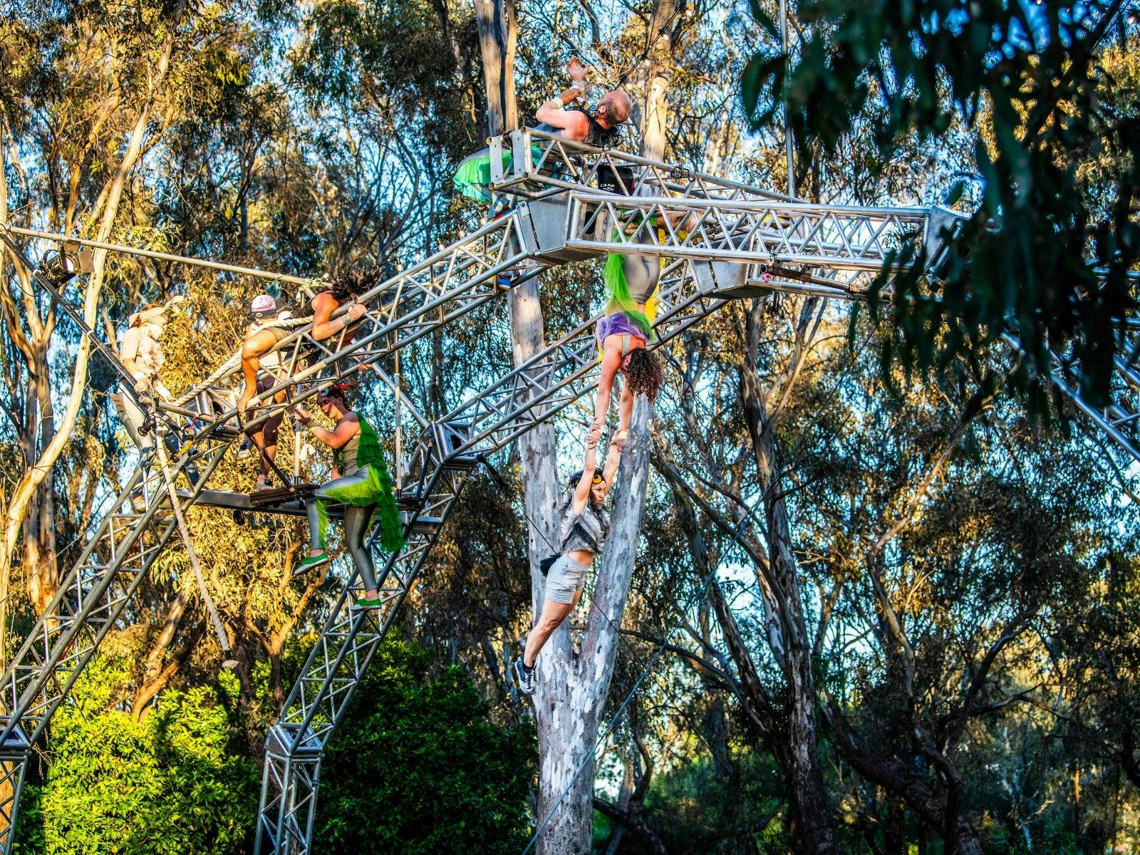 Performers on an outdoor aerial rig in the beautiful Gateway Island amphitheatre.