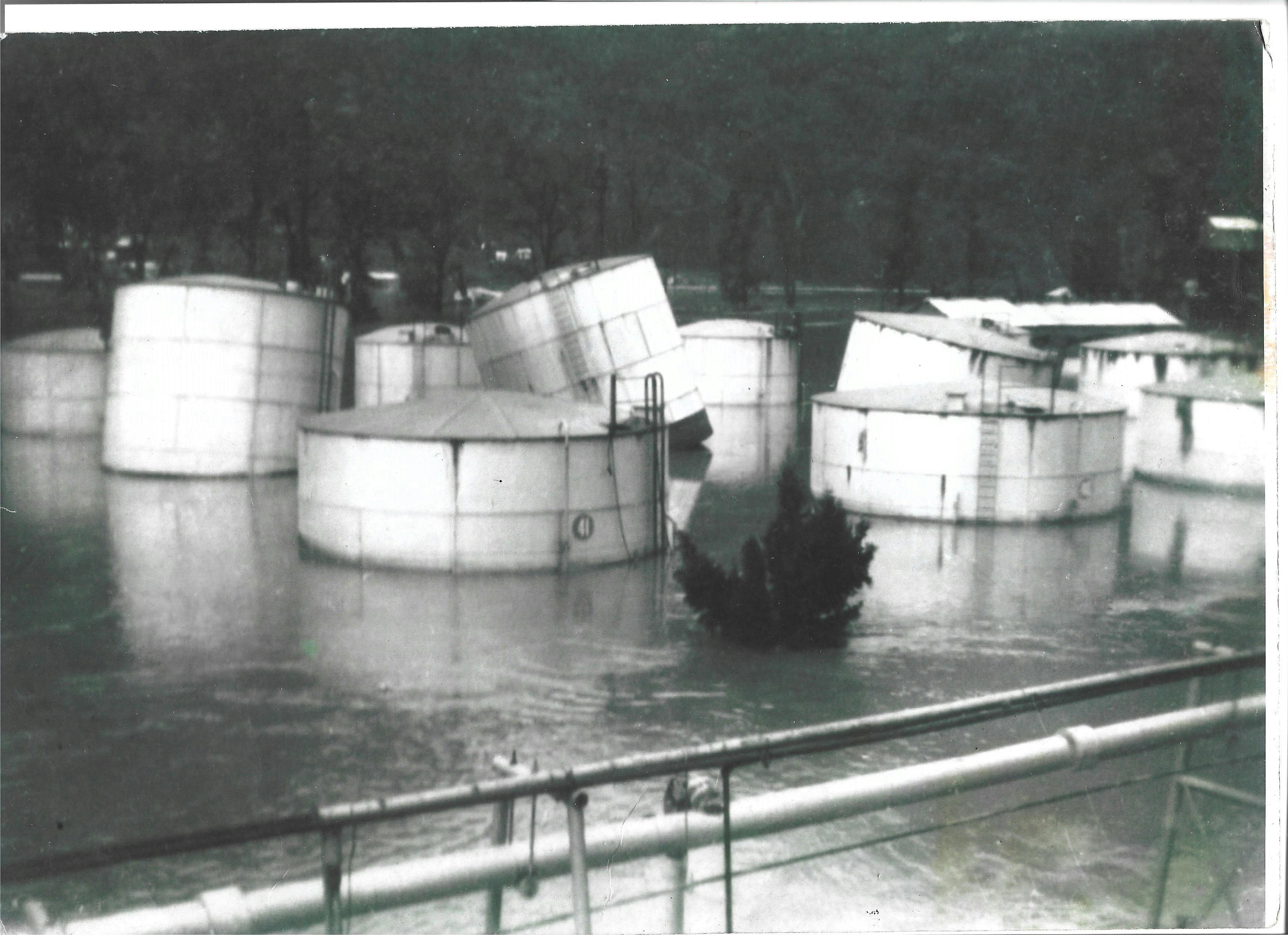 Floating petroleum tanks at Glen Davis Shale works, NSW, because of the Capertee River Flooding.