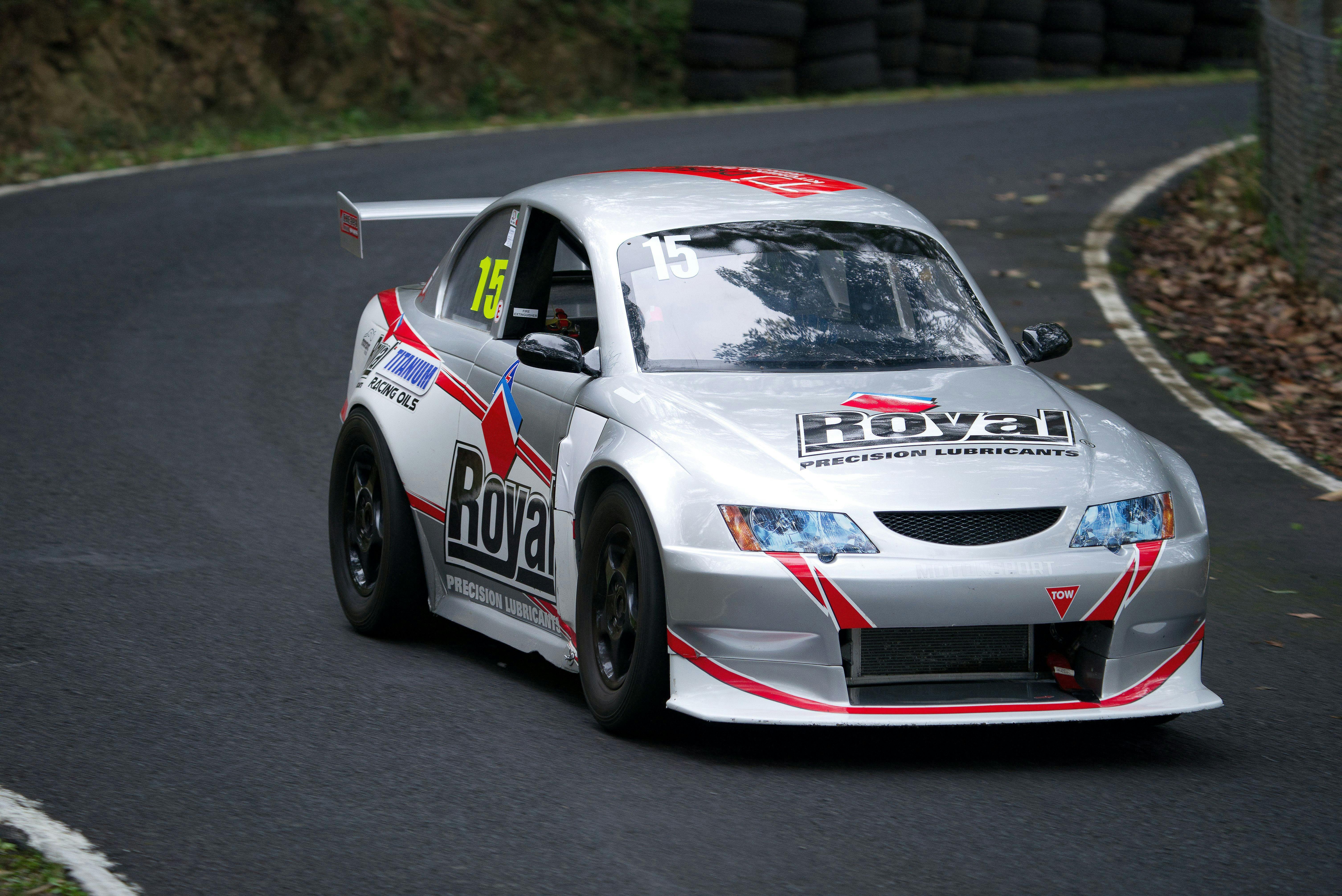 Exiting the first loop is an Aussie Racing Car in the Supersports/Sports 1300 class