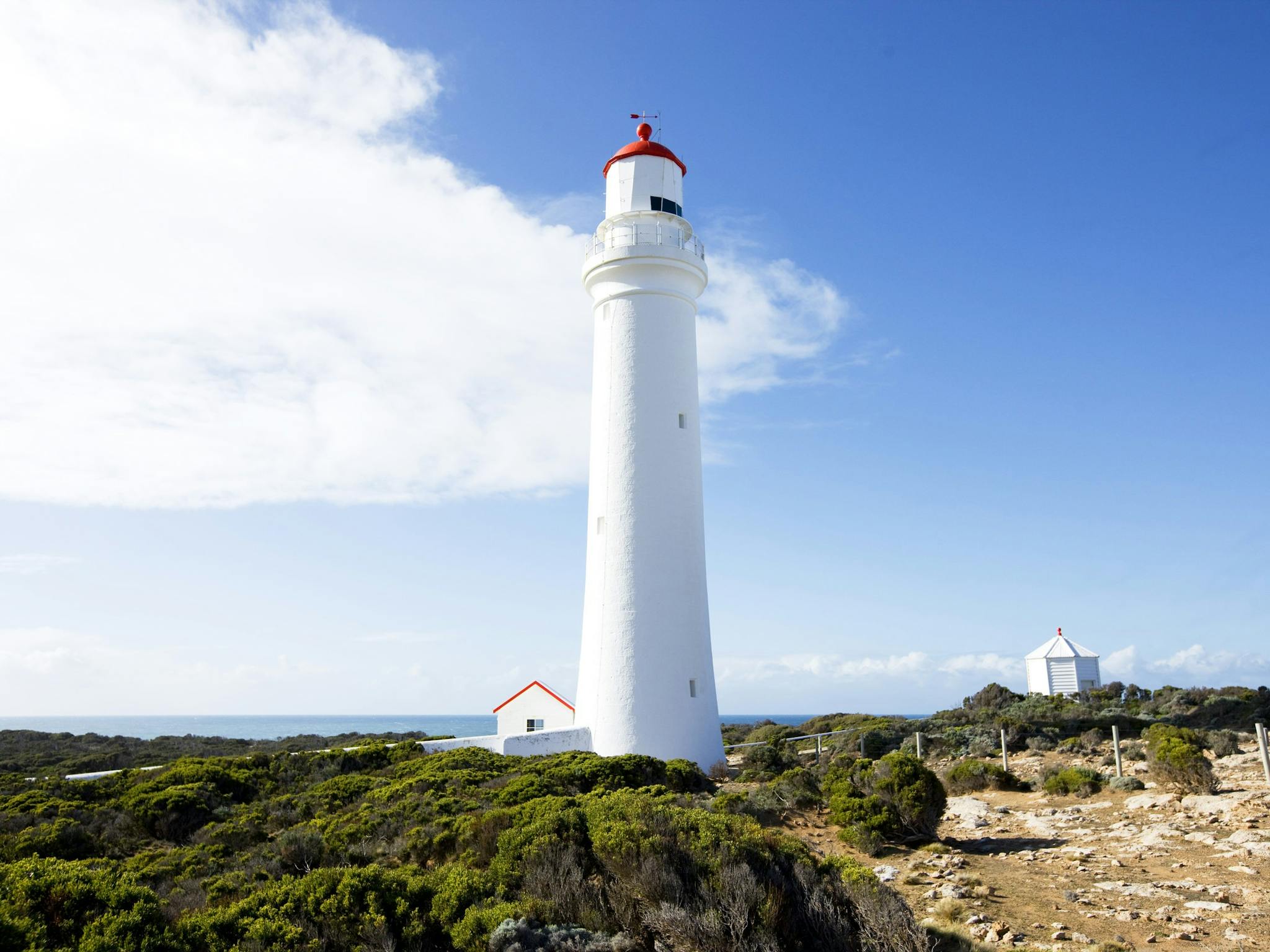 Portland Lighthouse with blue sky behind