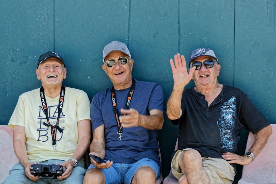 3 male seniors with cameras on tour