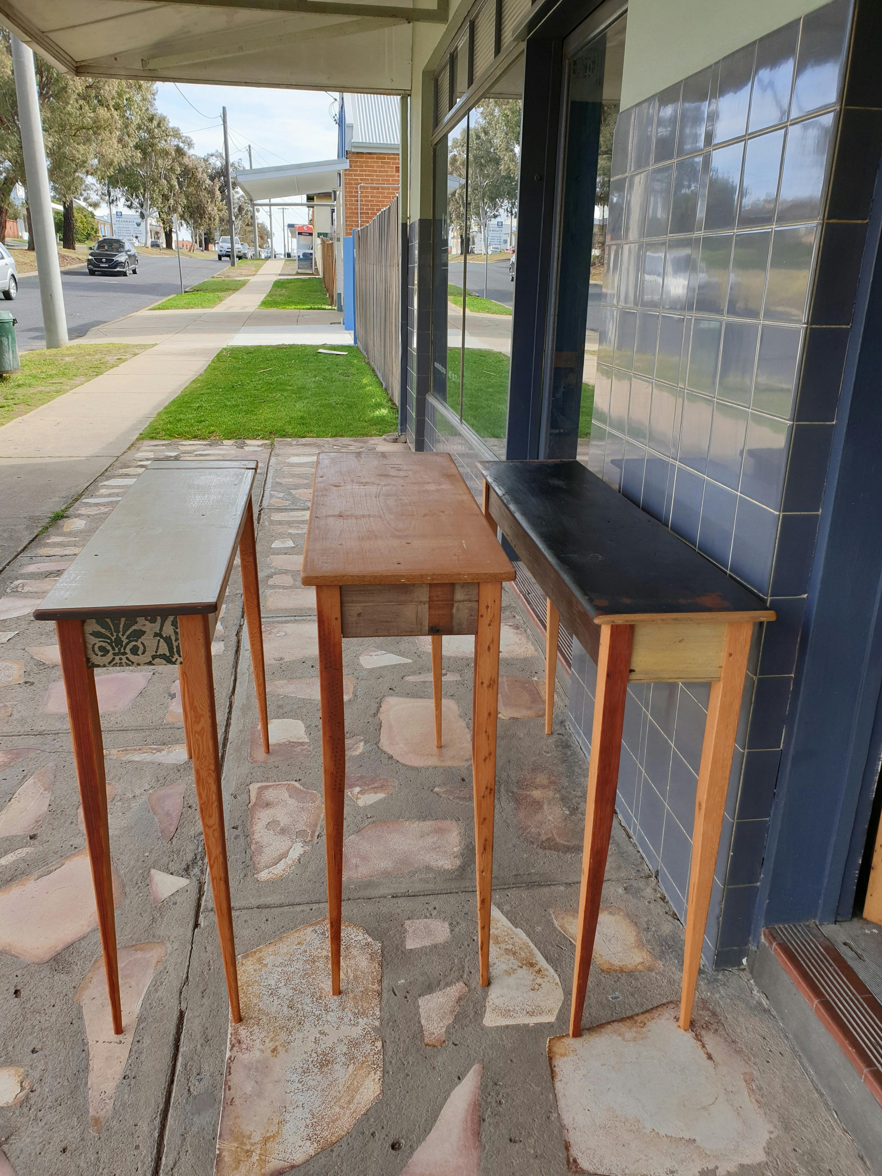 Three tall skinny hall tables