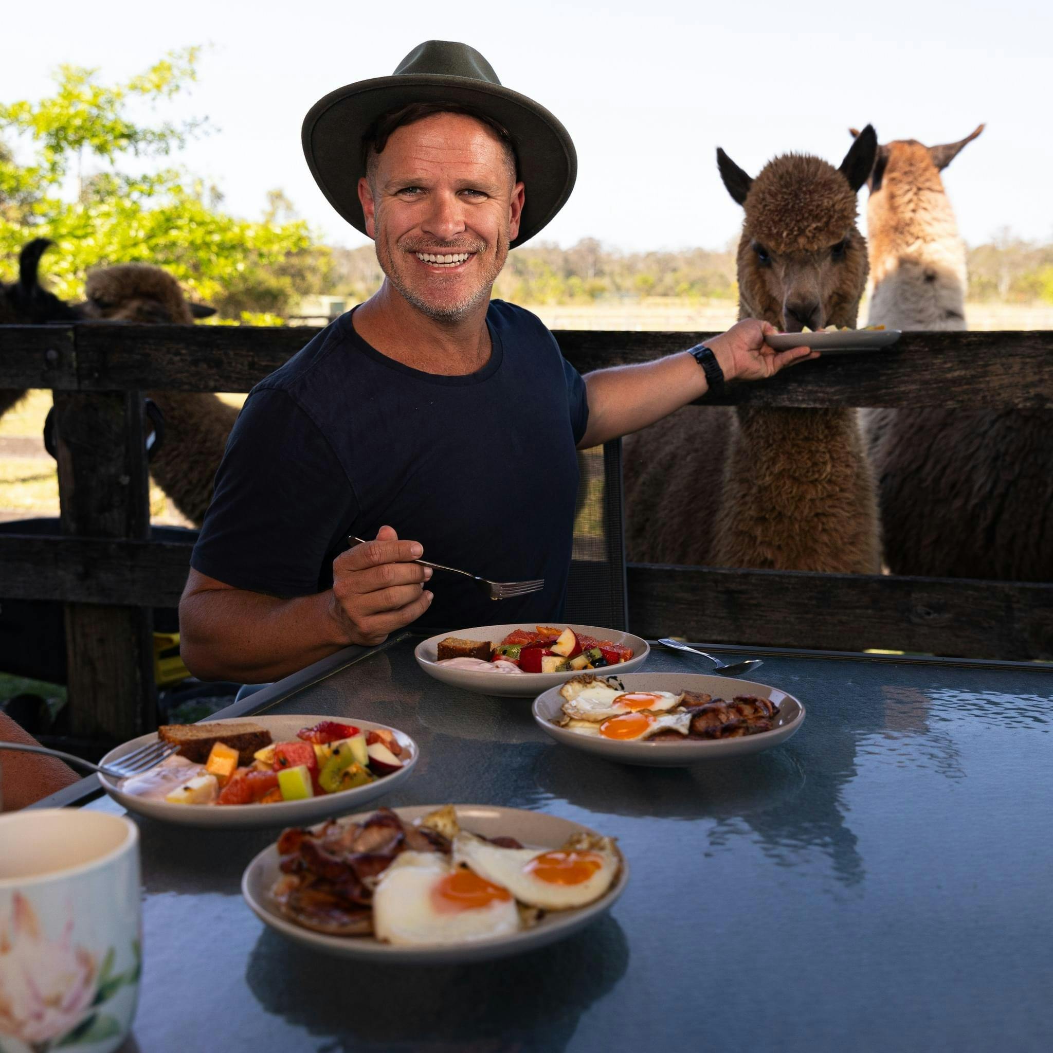 Enjoying breakfast with our alpacas