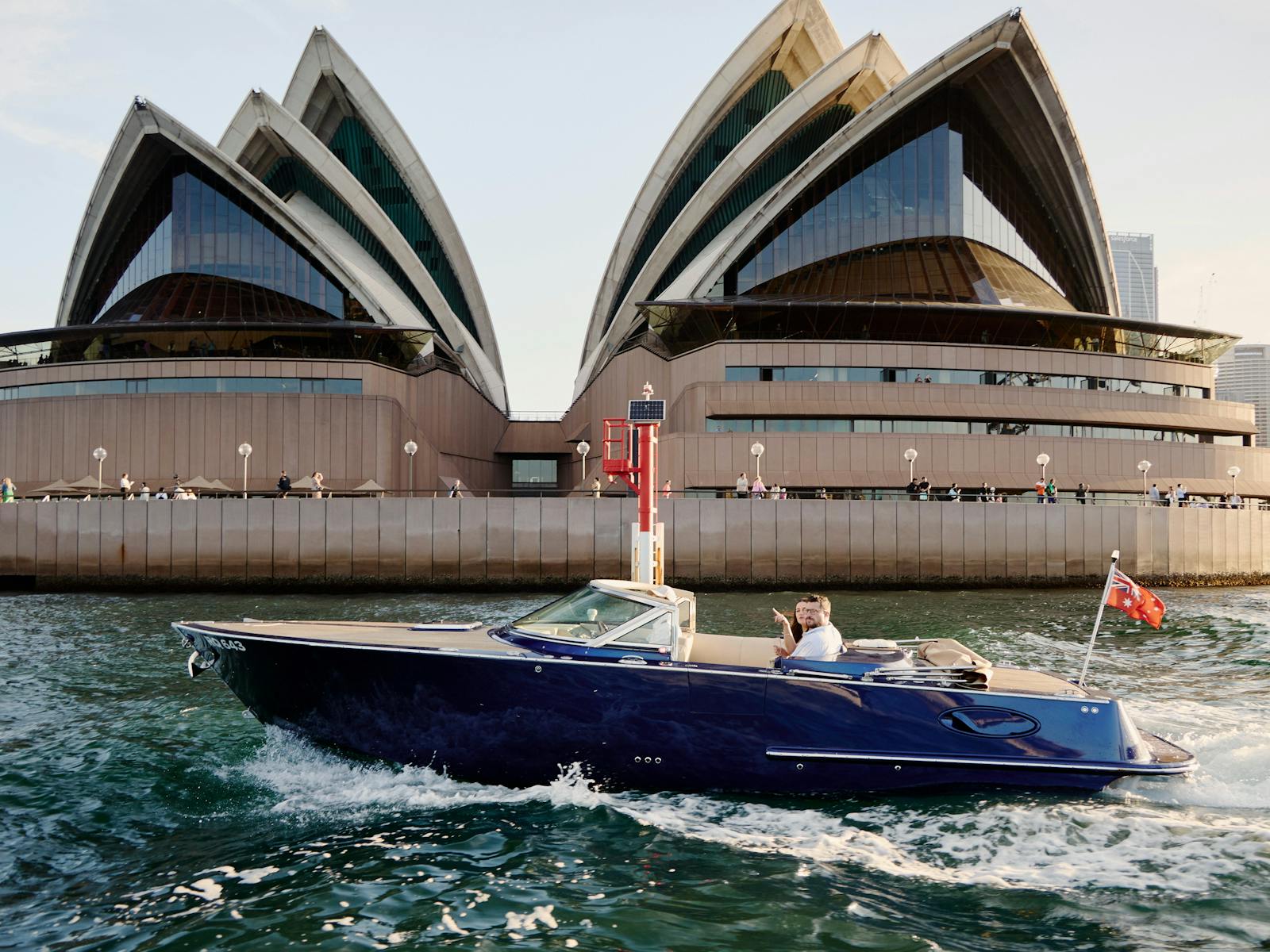 Private boat tour on MV Aquamajestic cruising Sydney Harbour with city skyline views.