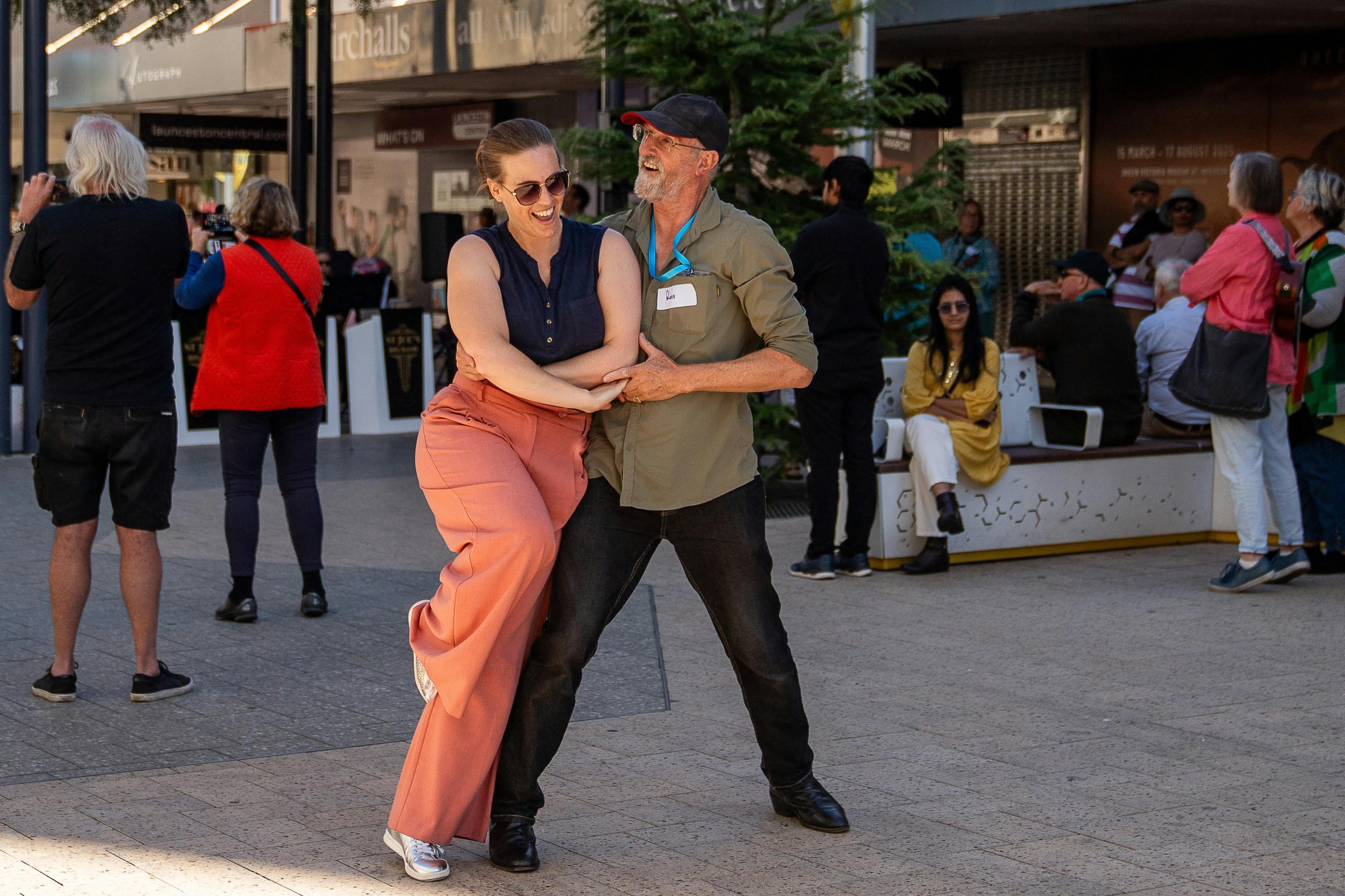 Couple dancing in the mall