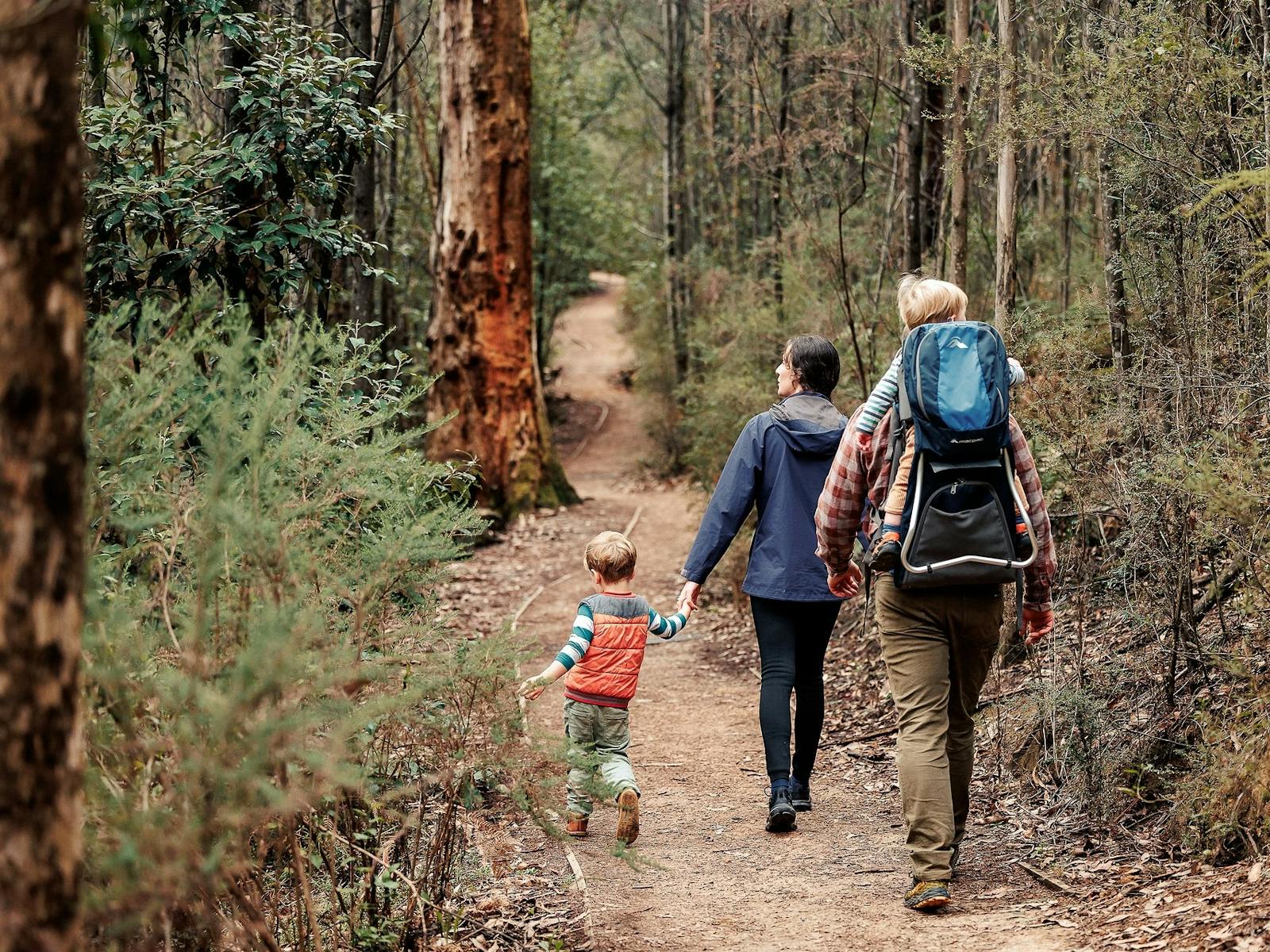 family of four walking