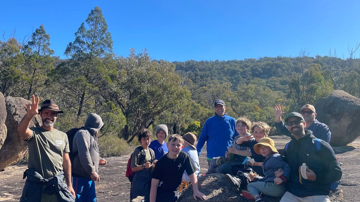 group of people on a rock