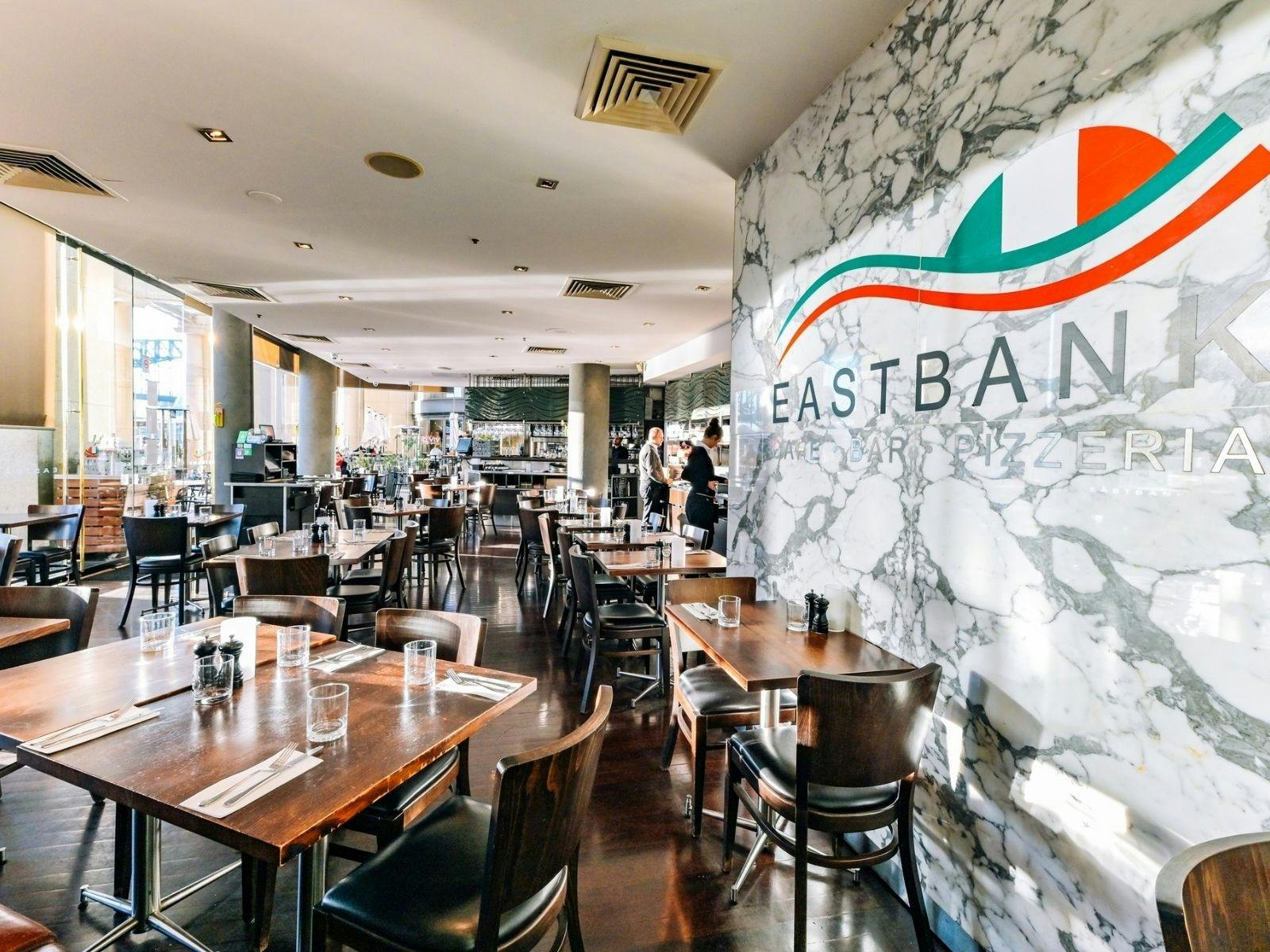 Eastbank Cafe interior dining area allowing natural light and windows for harbour views