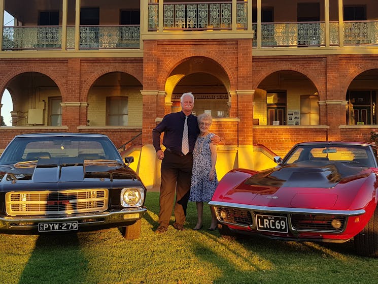 Vintage cars on lawn at museum