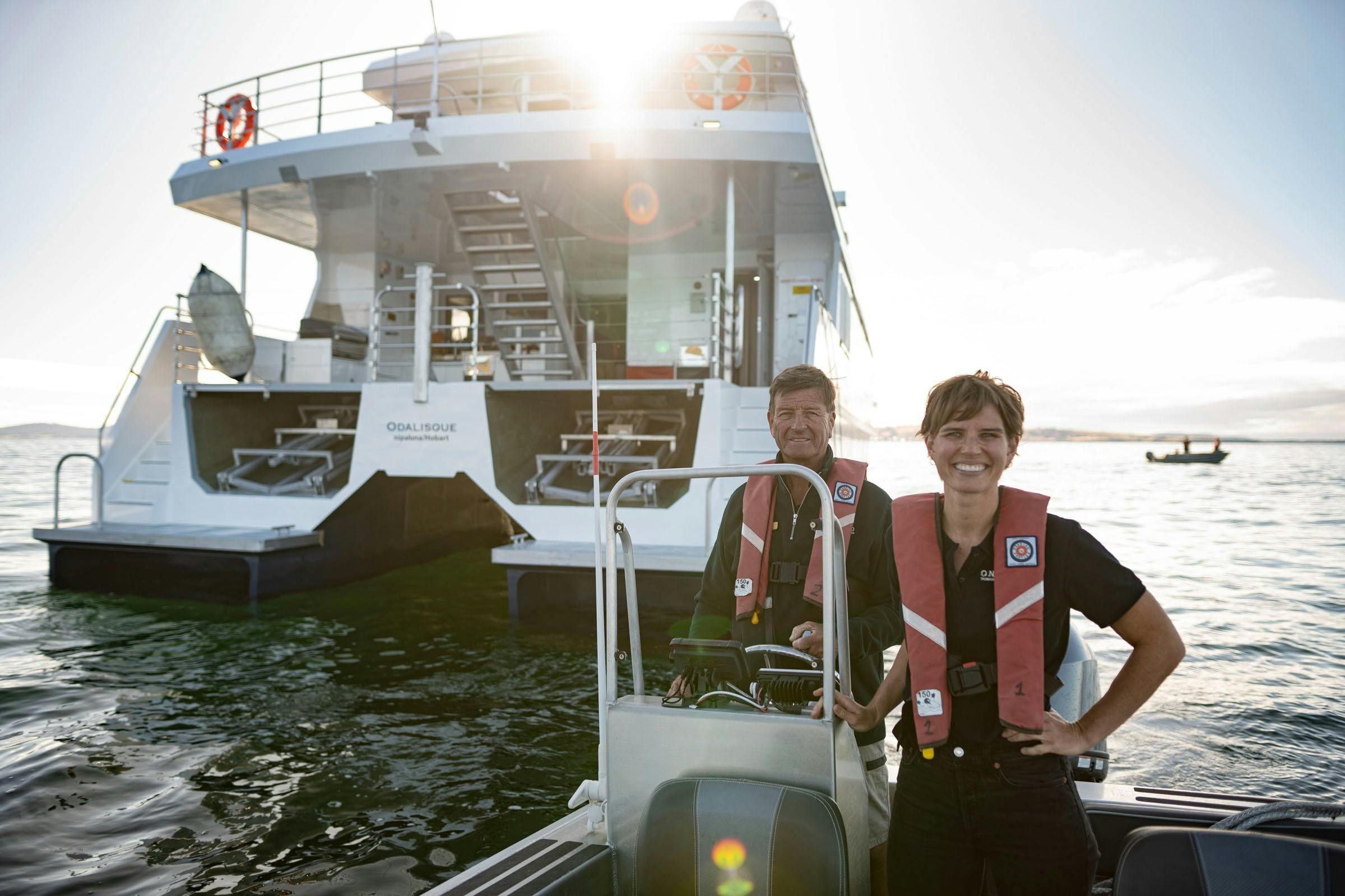 On Board's Pieter and Alice van der Woude in front of expedition vessel Odalisque