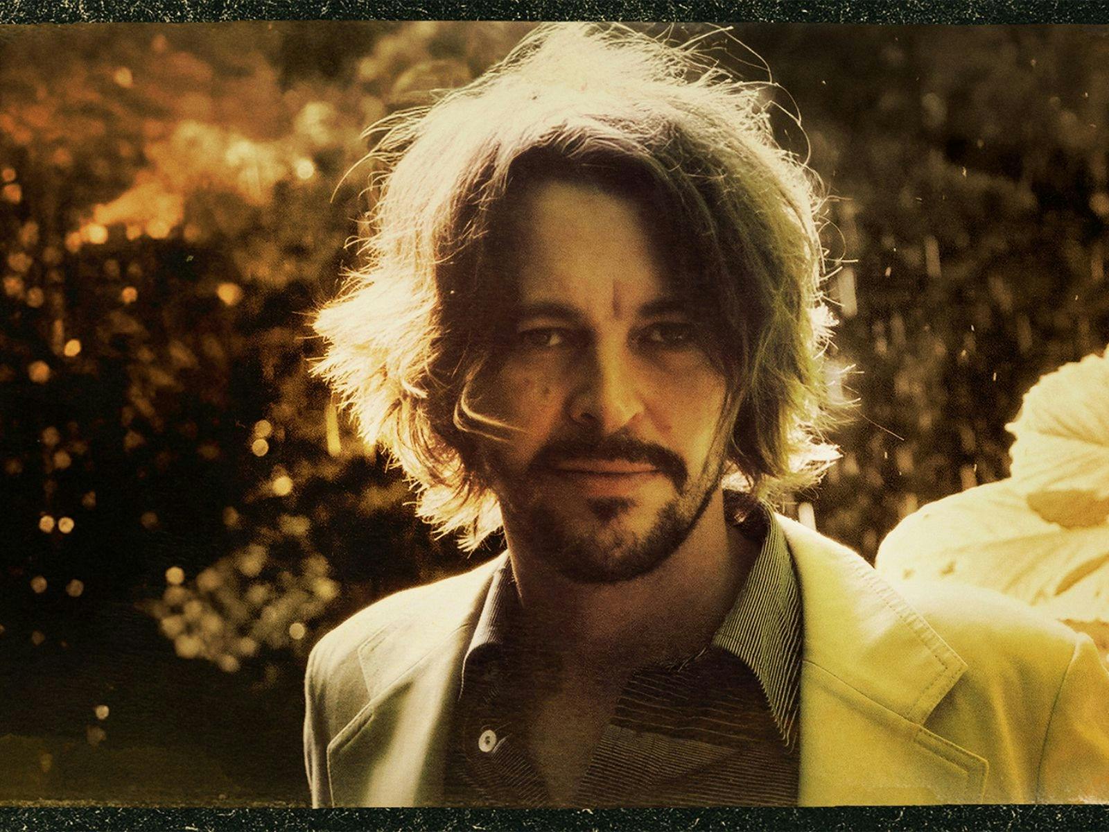 Bernard with long hair and beard with sun shining on his hair