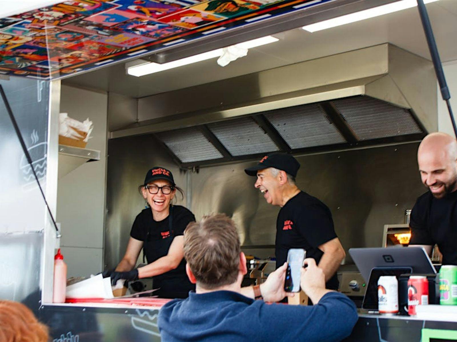 Unkle K and Co serving food
