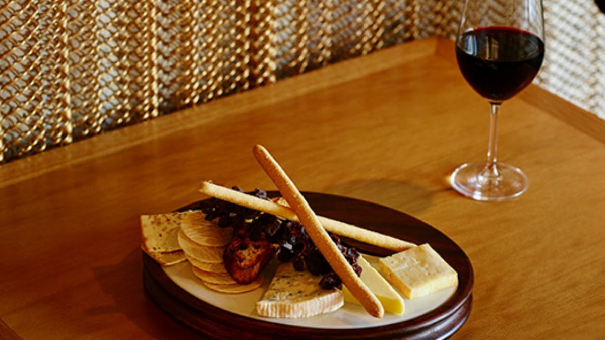 Savour a gourmet cheese plate & explore our exquisite wine selection.