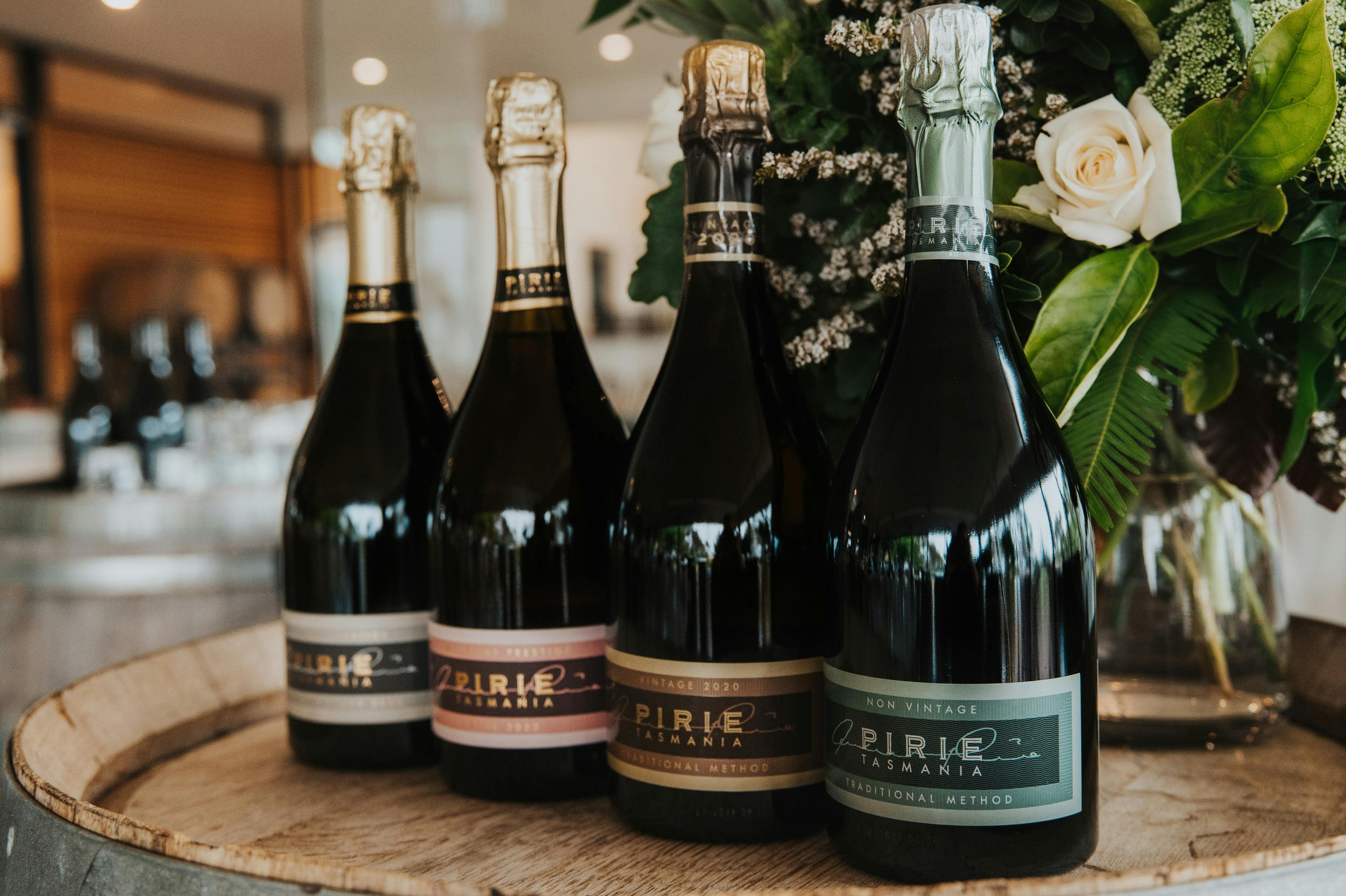 Range of Pirie wines lined up on barrel