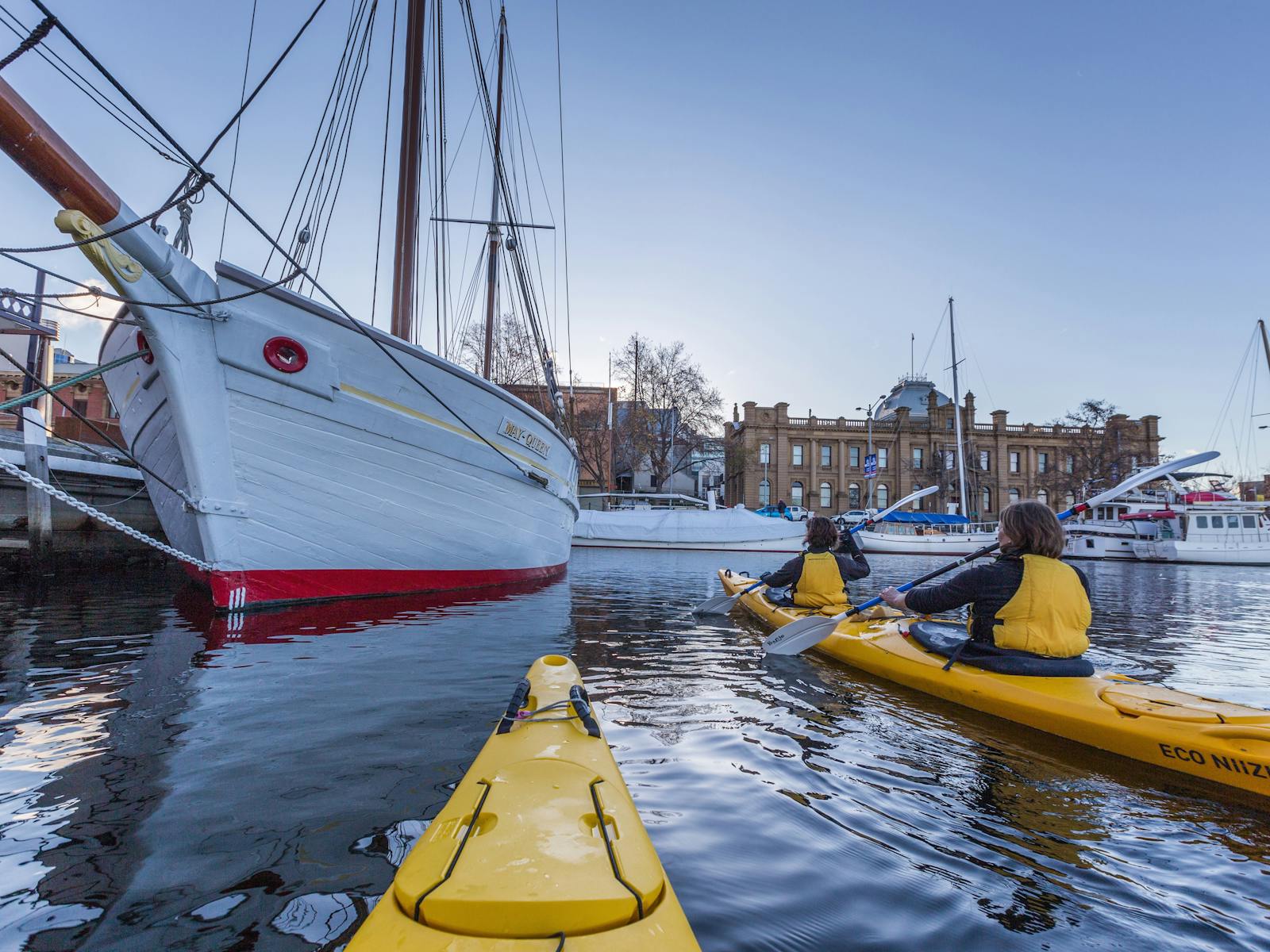 Kayakers near wood sailing boat-Hobart waterfront